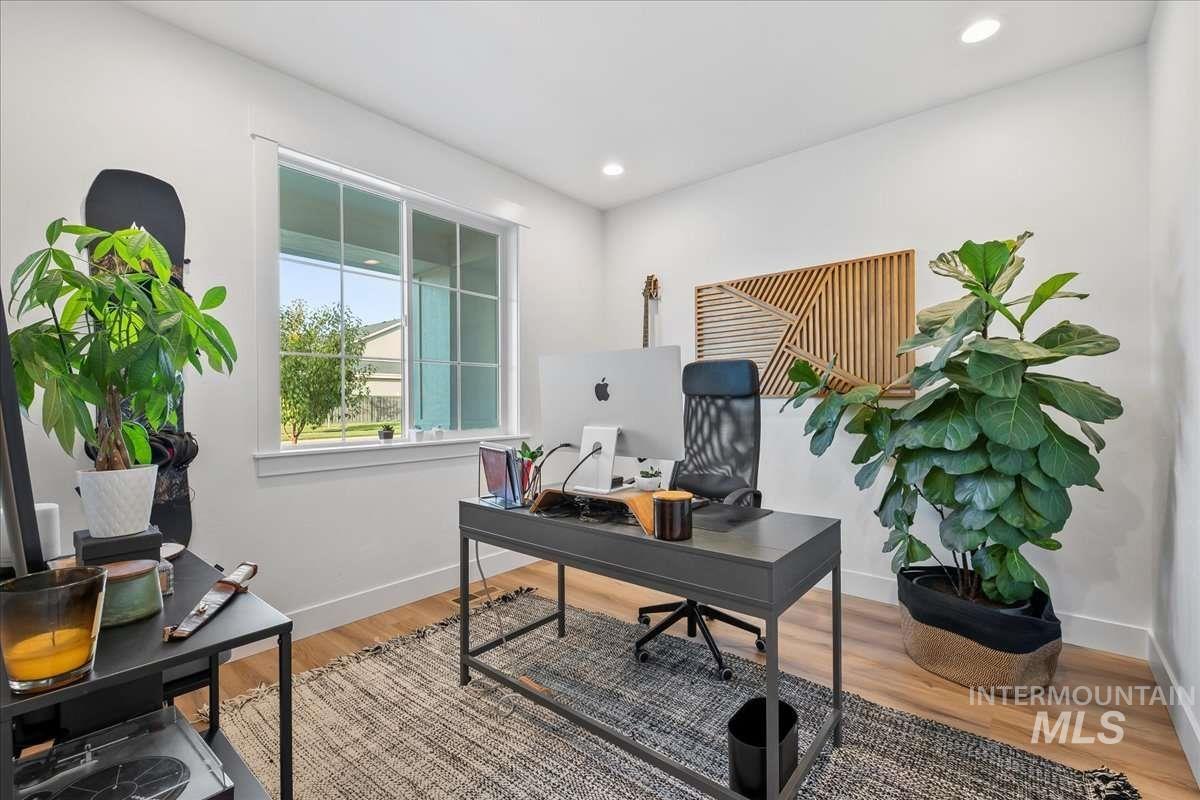 Office featuring light wood-style floors and recessed lighting