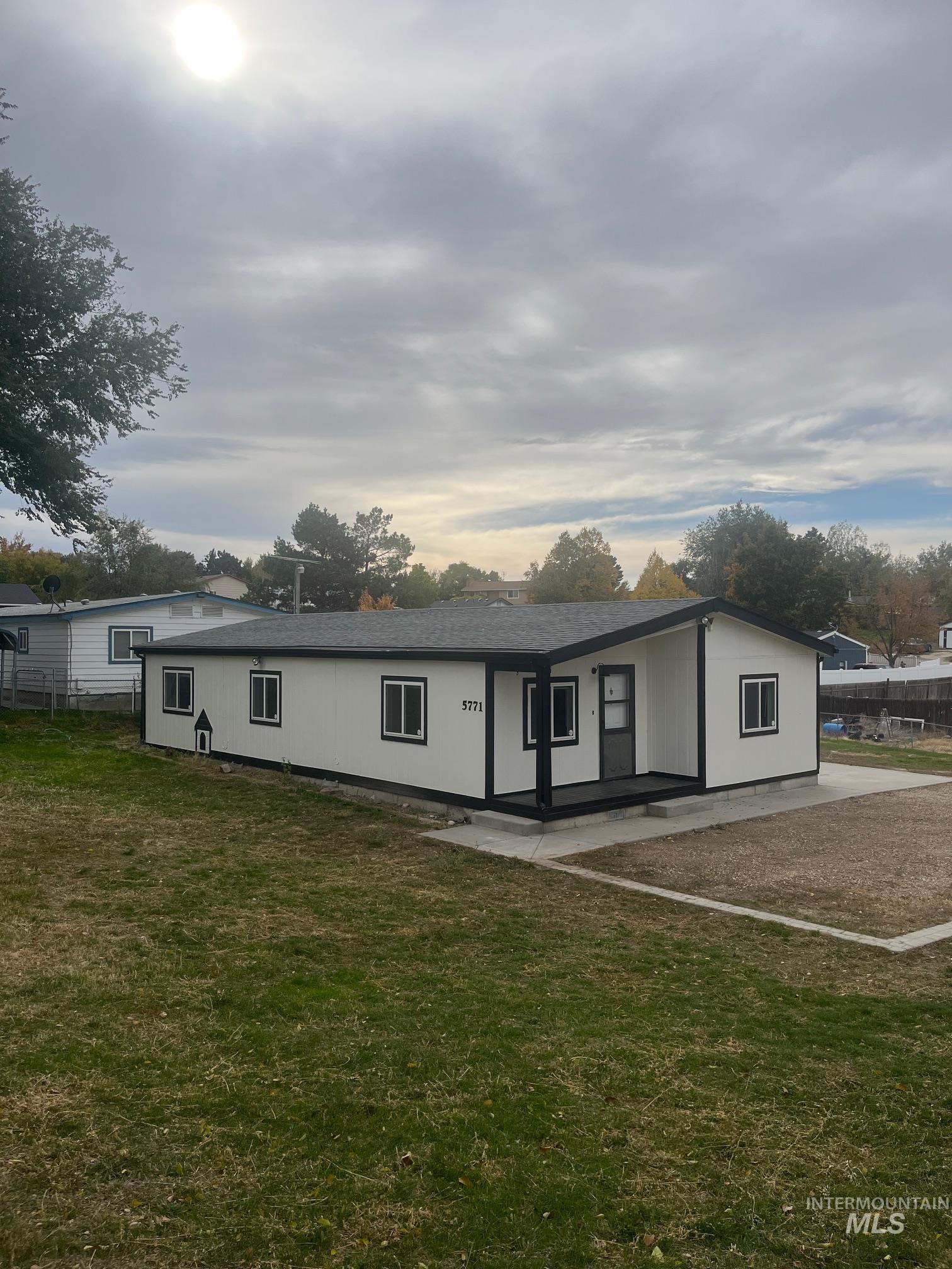 Single story home featuring a front yard