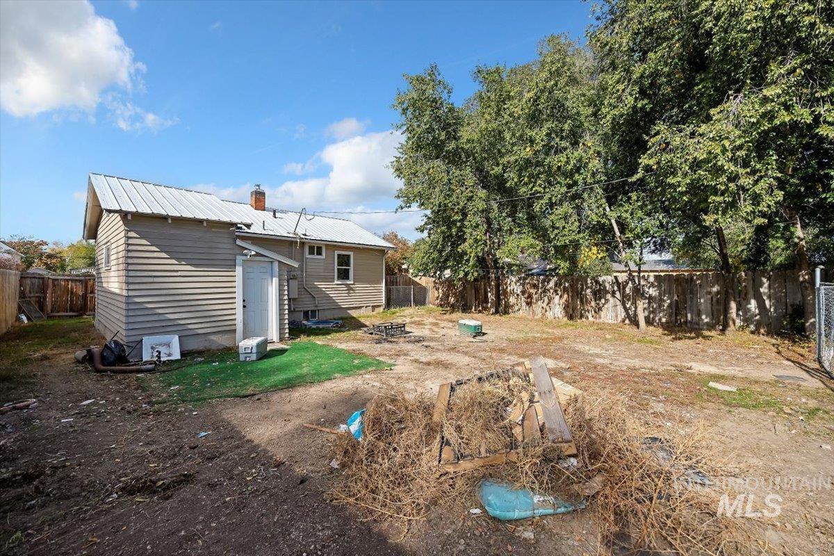 View of fenced backyard