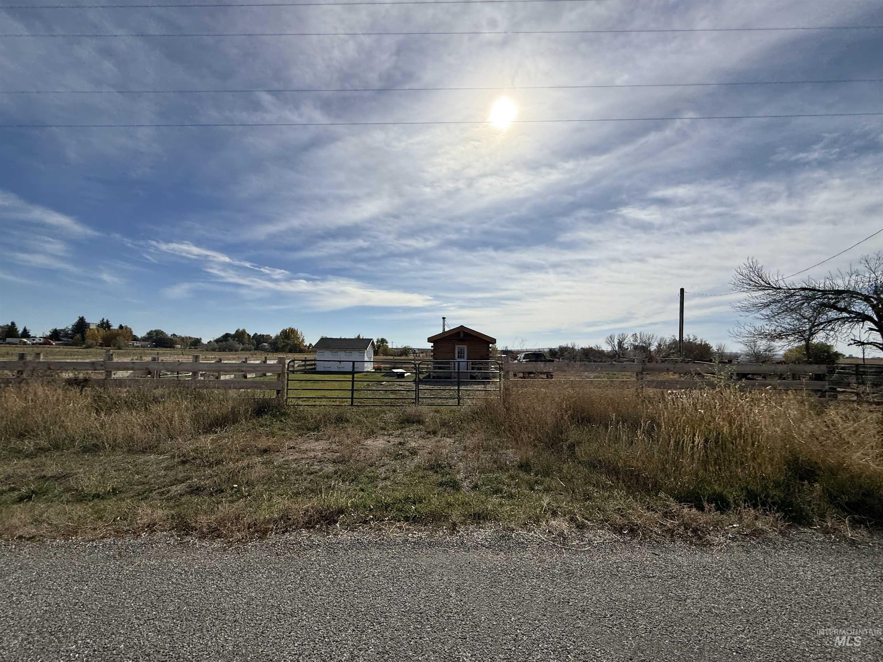 View of yard featuring a view of rural / pastoral area and an outbuilding