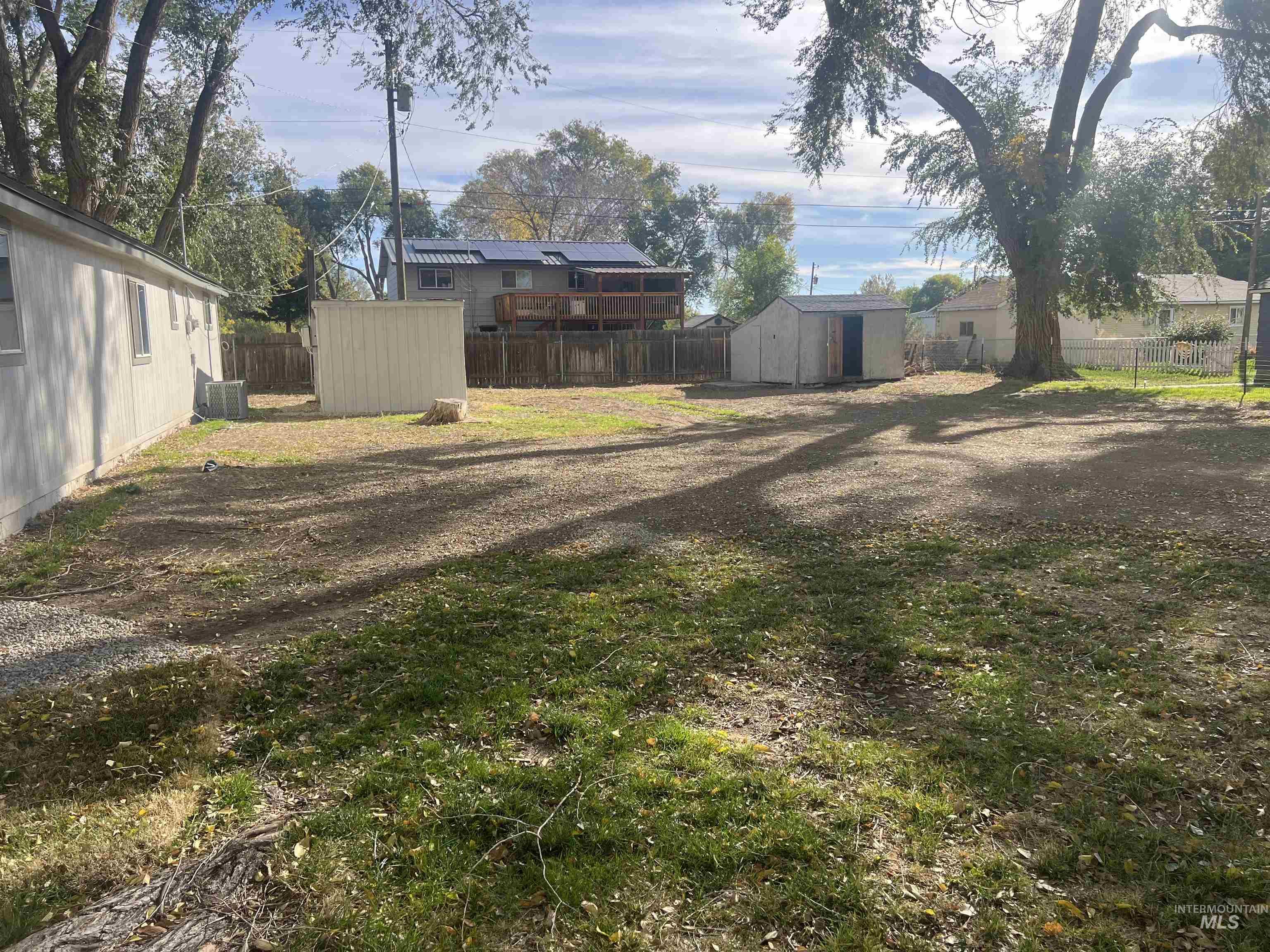 Fenced backyard with a shed