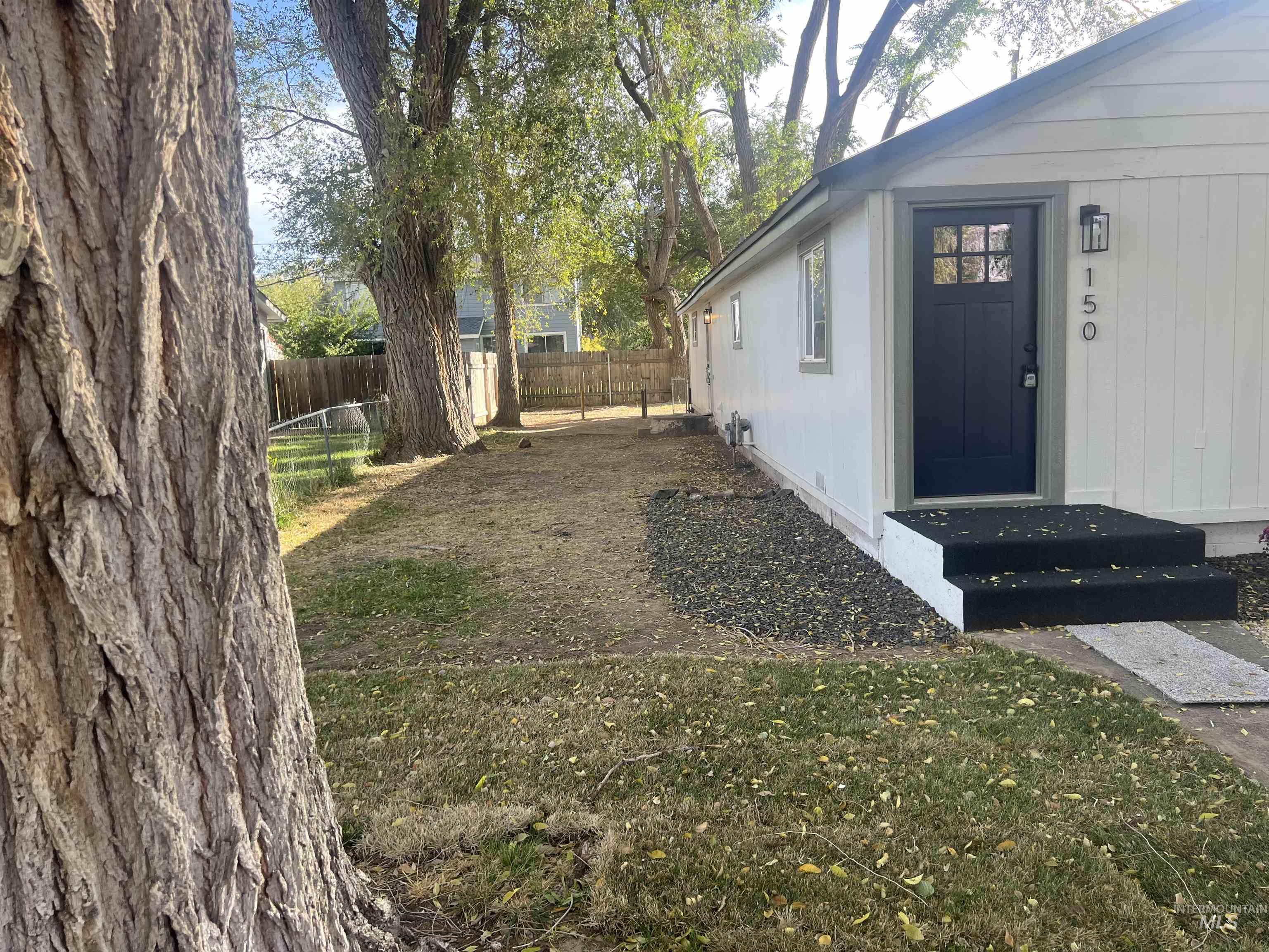 View of fenced backyard