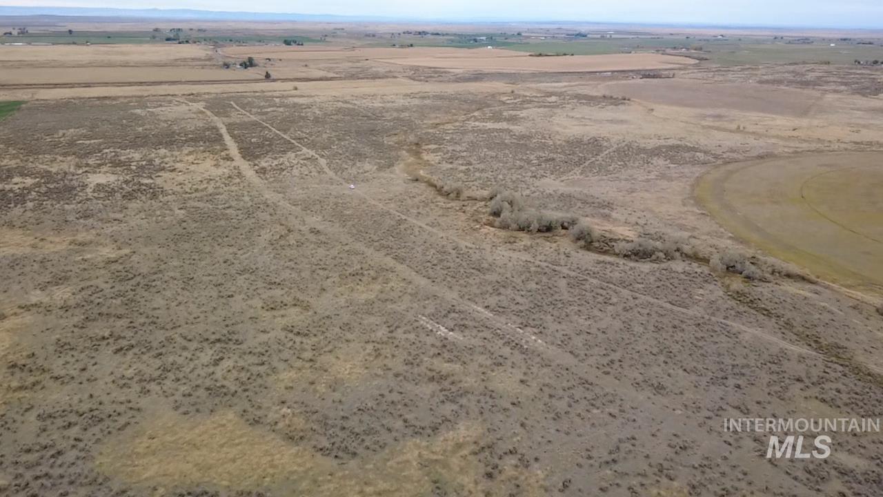 Aerial overview of property's location featuring rural landscape and a desert landscape