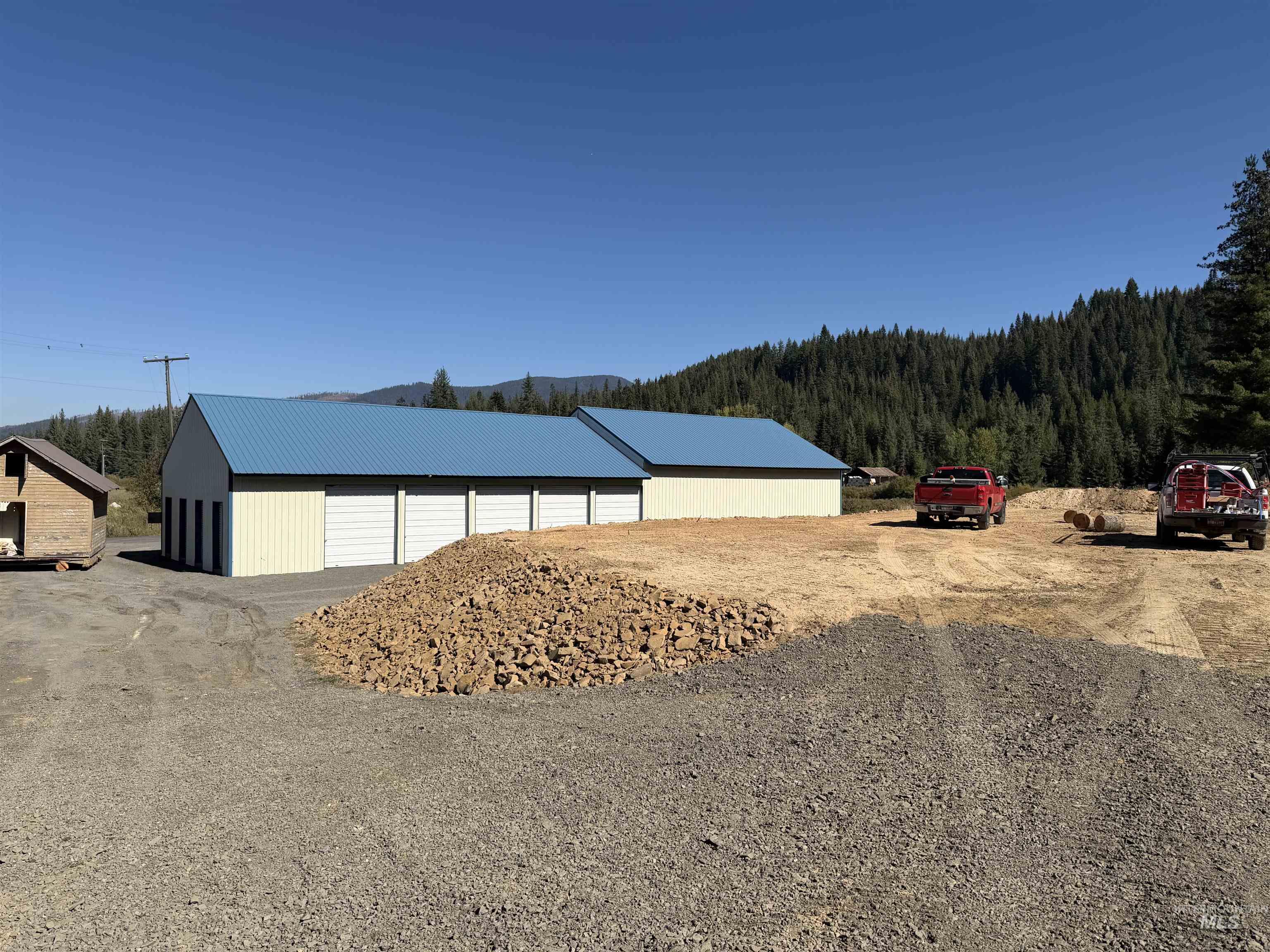 View of pole building featuring a wooded view