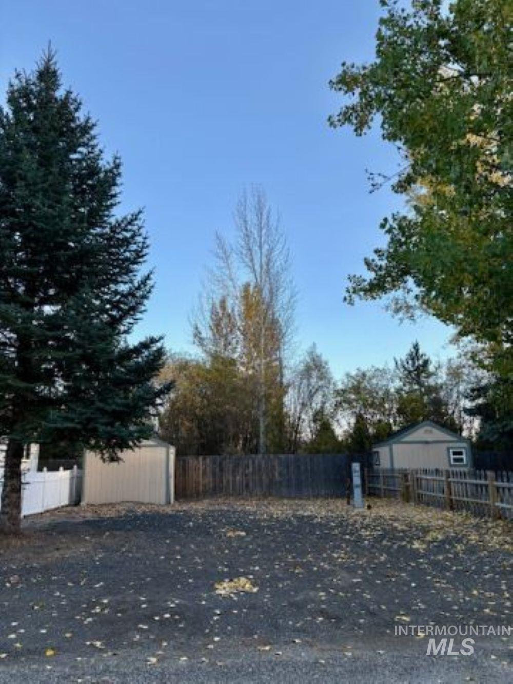 View of property exterior with an outdoor structure