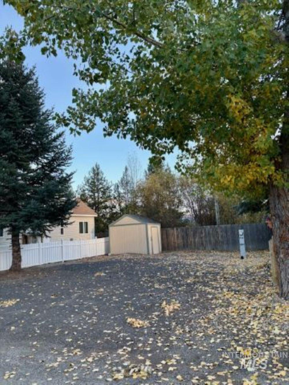 Fenced backyard with a shed