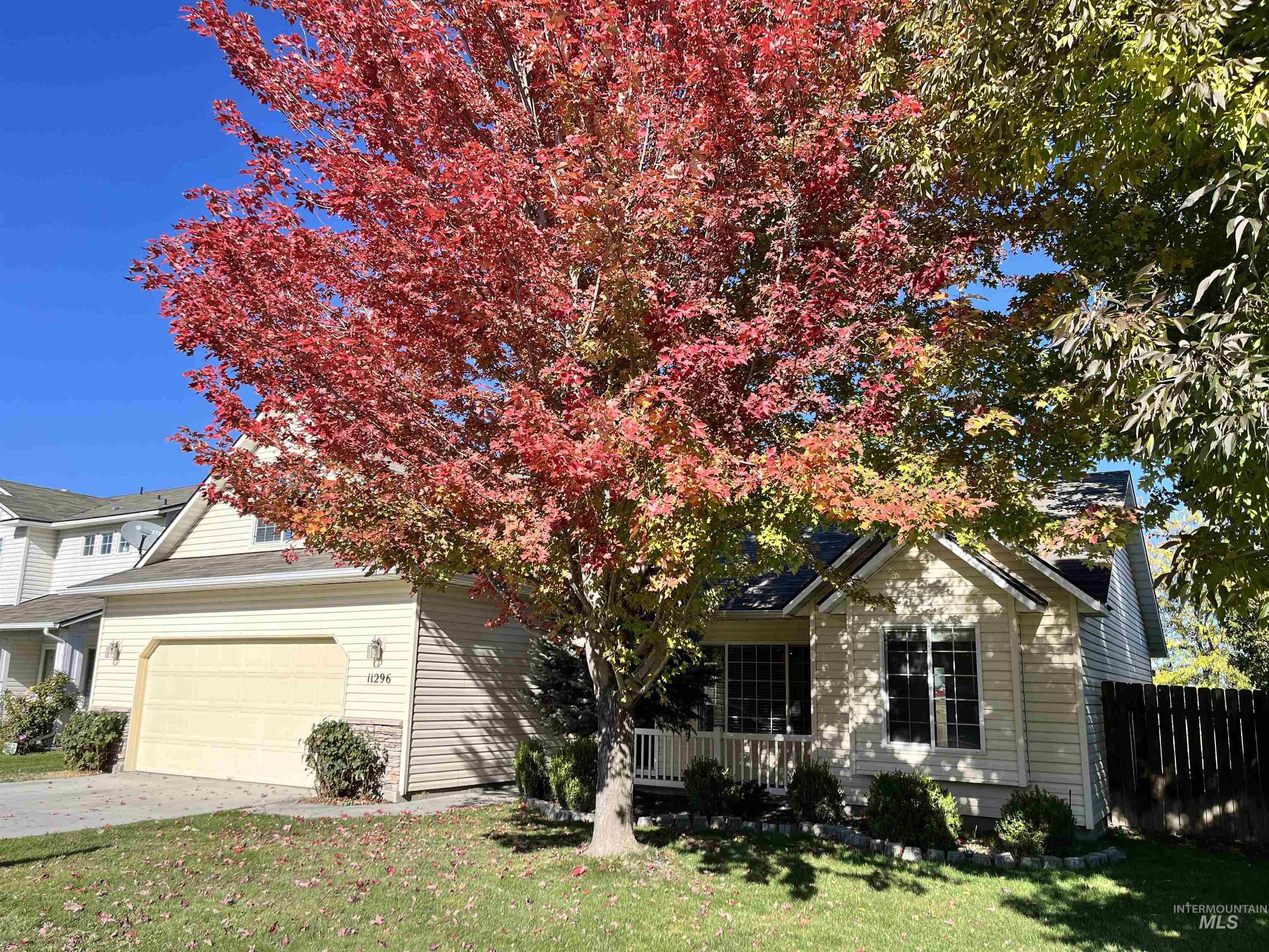 Obstructed view of property with driveway and a garage