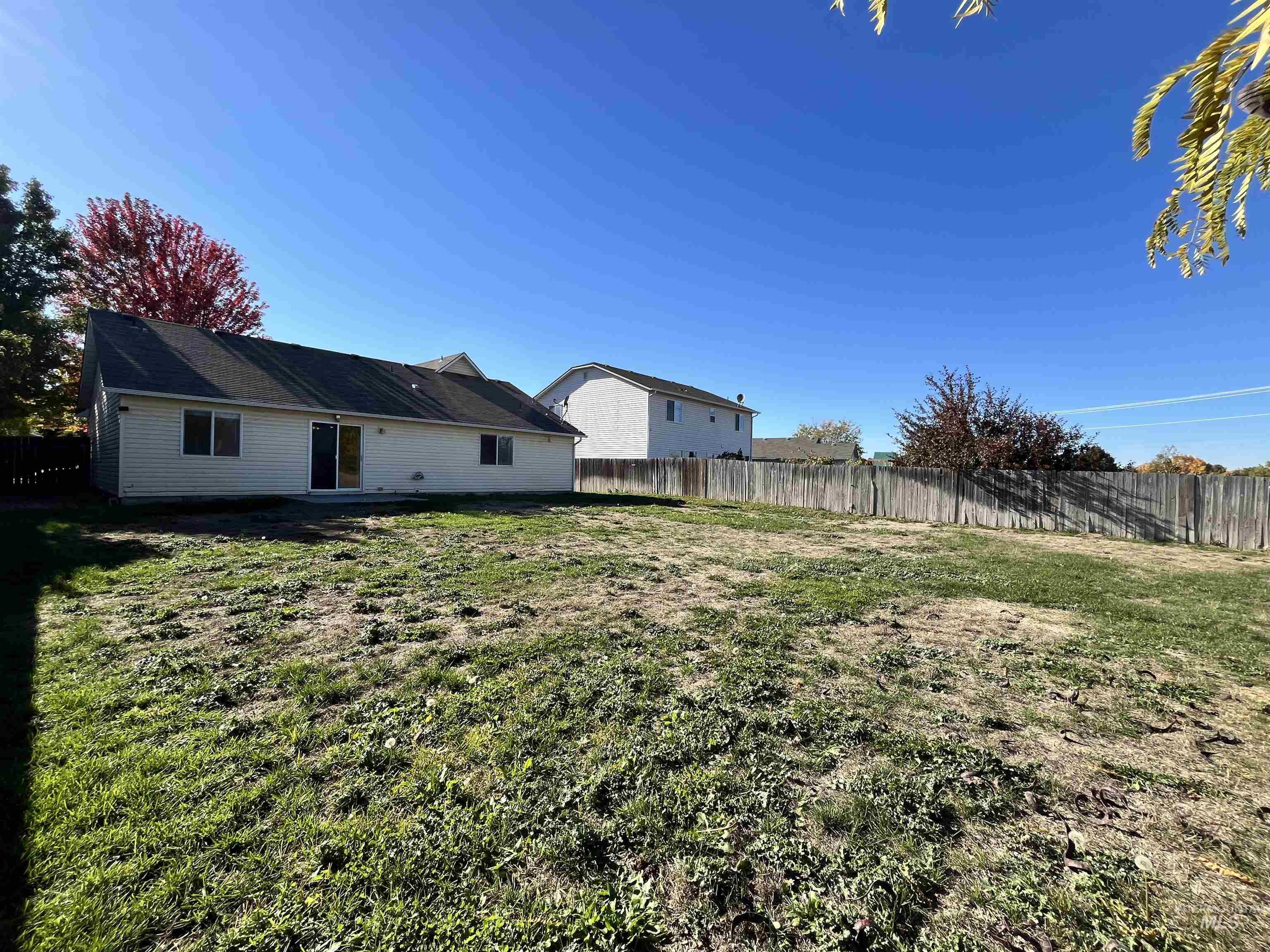 View of fenced backyard