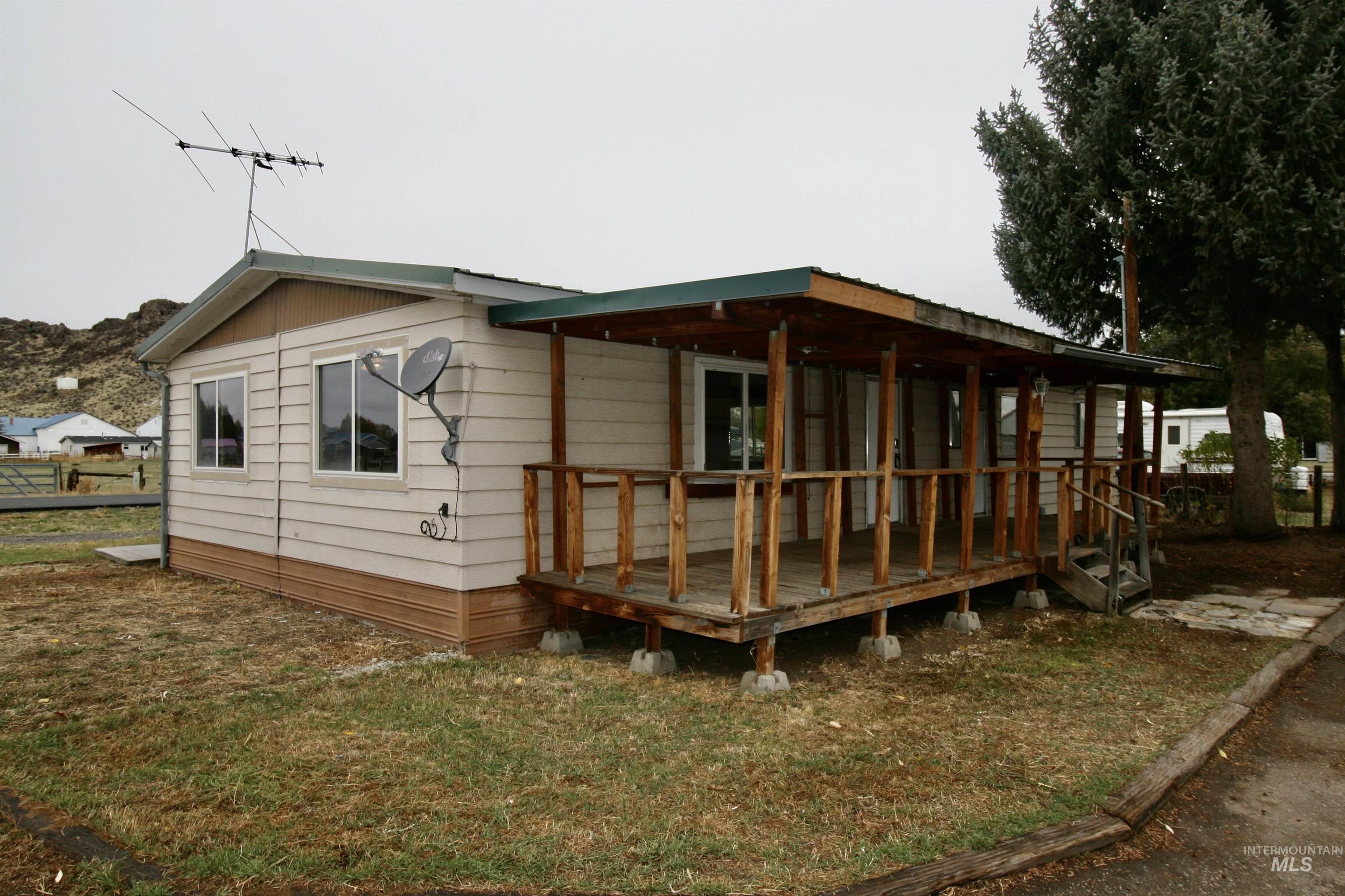 Back of property featuring a wooden deck