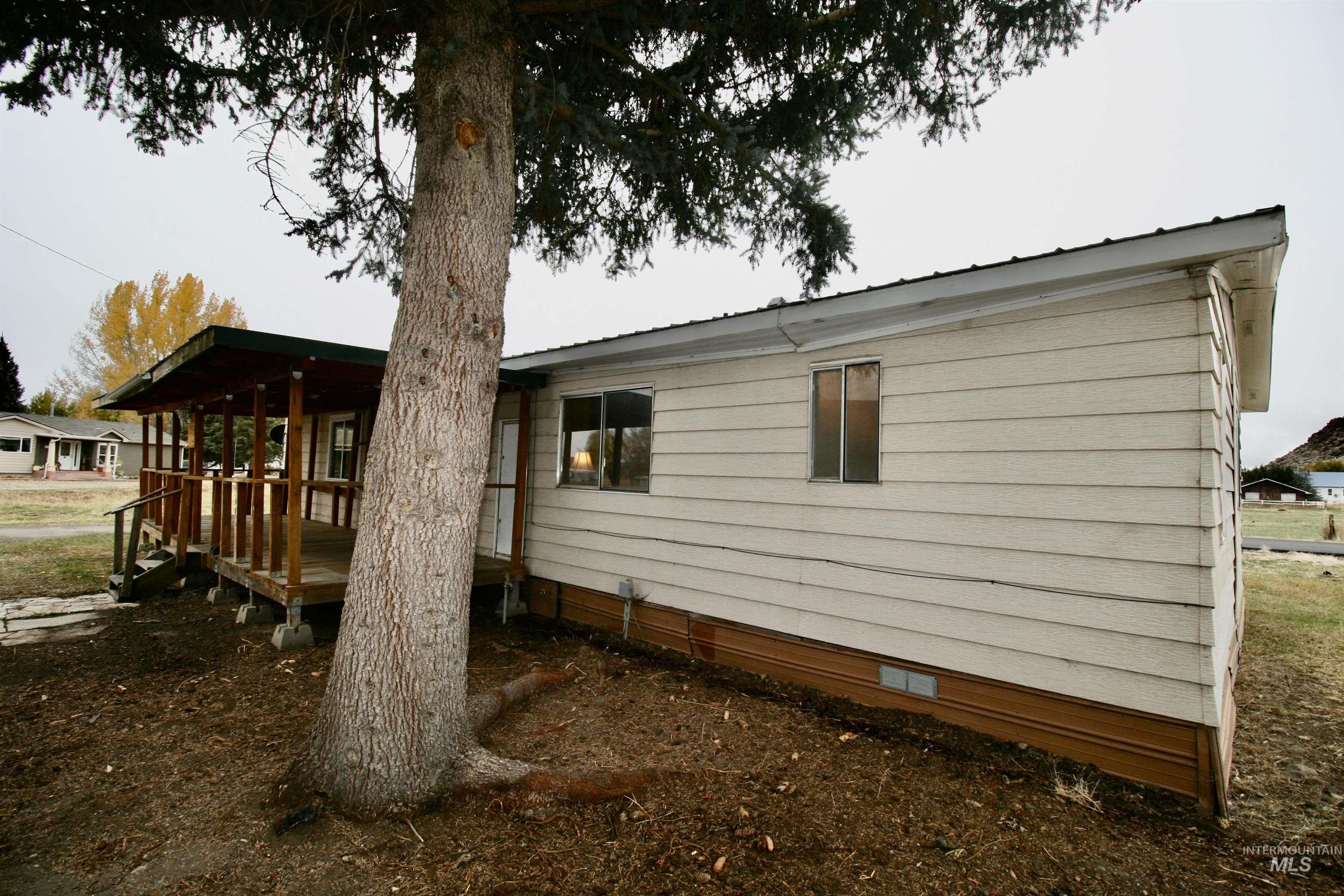 View of property exterior featuring a deck