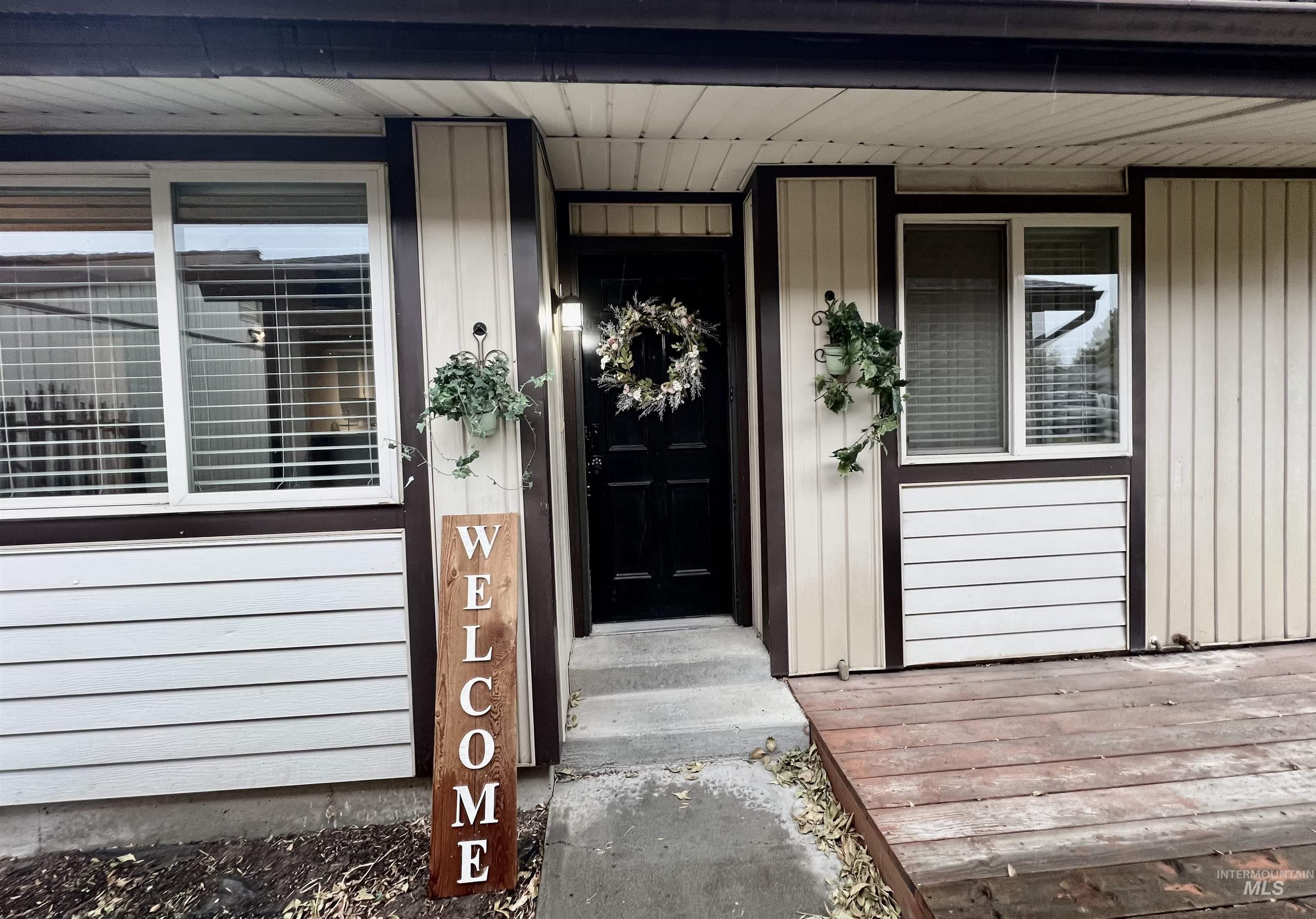 Doorway to property featuring a porch