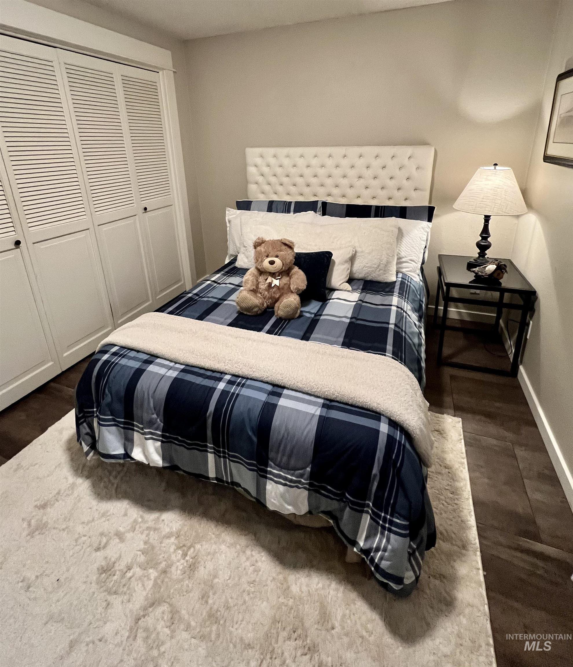 Bedroom with a closet and baseboards
