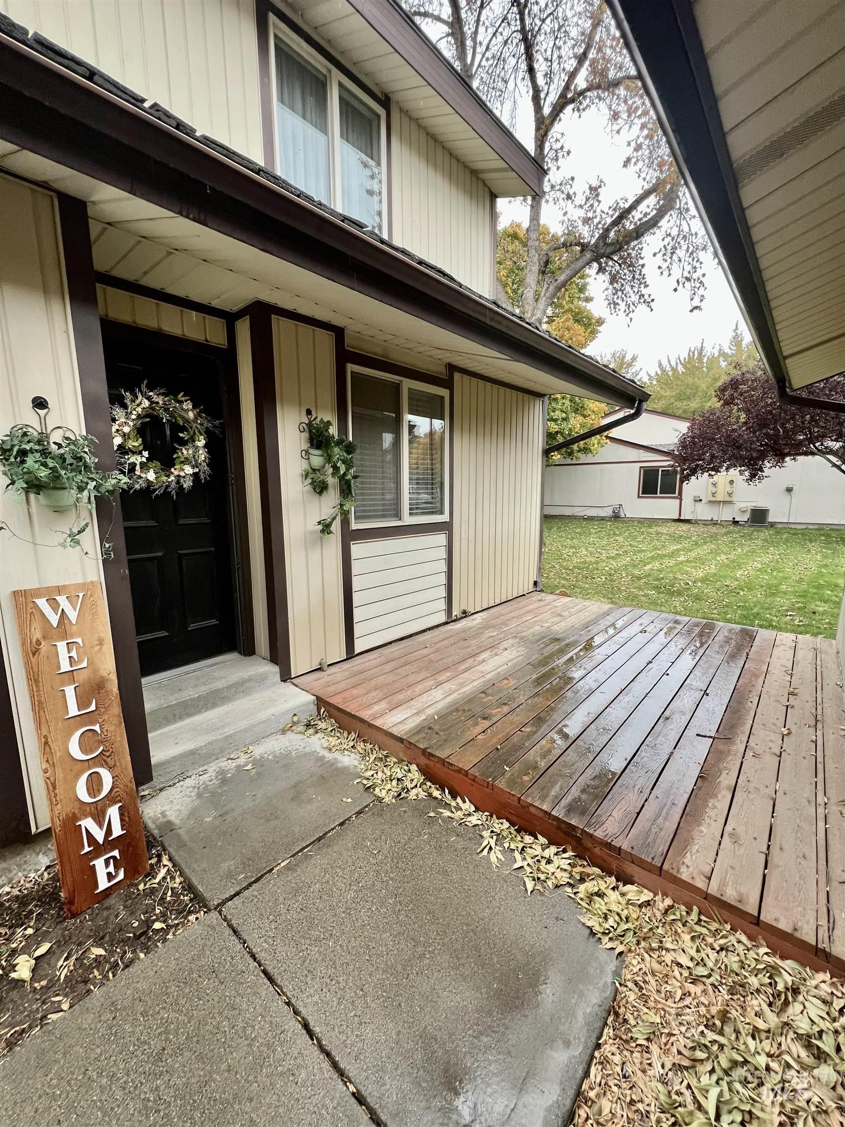 Entrance to property featuring a deck