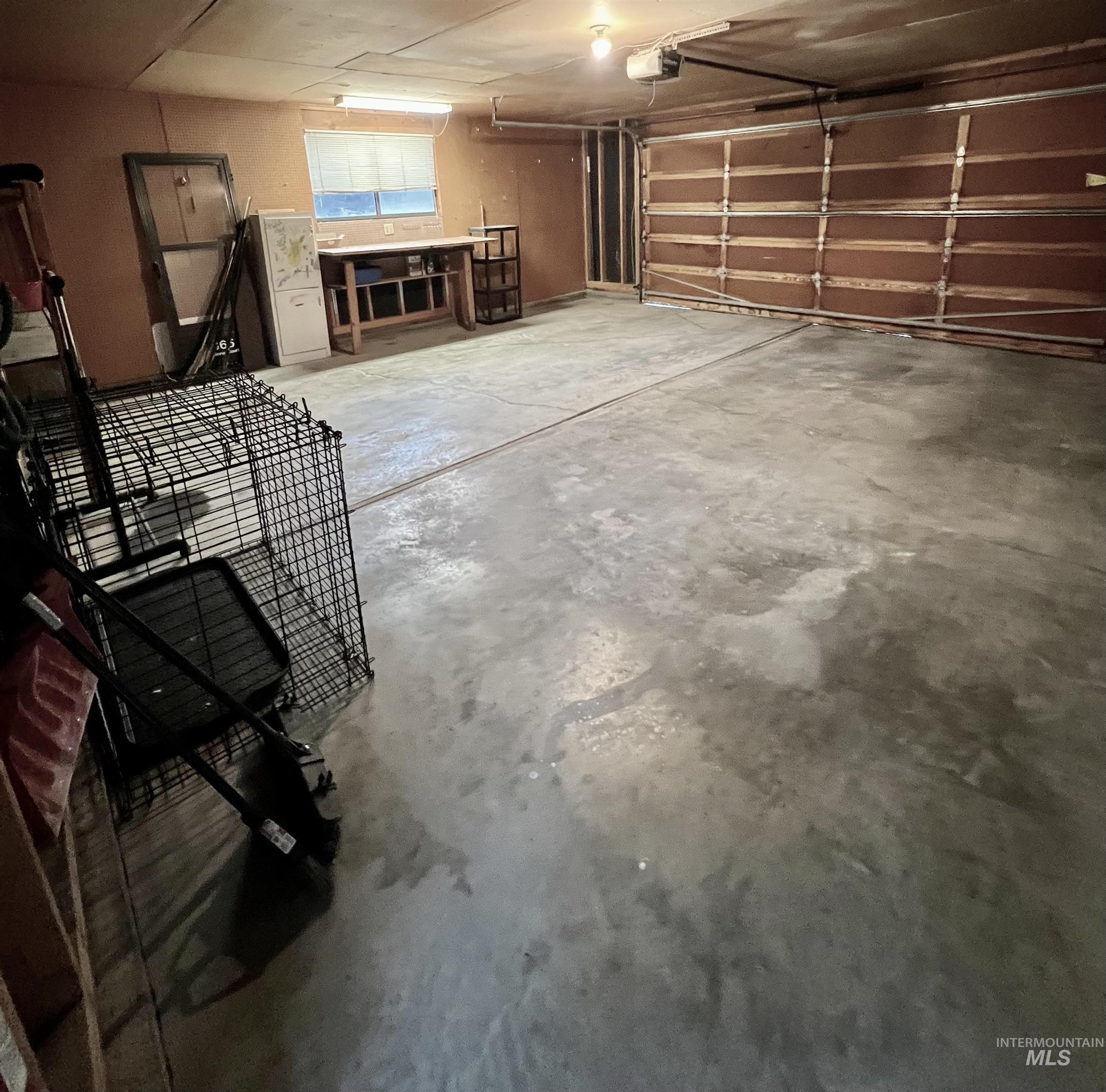 Garage featuring a garage door opener