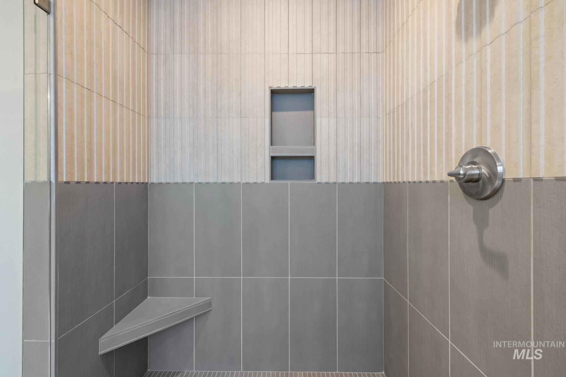 Bathroom featuring a tile shower