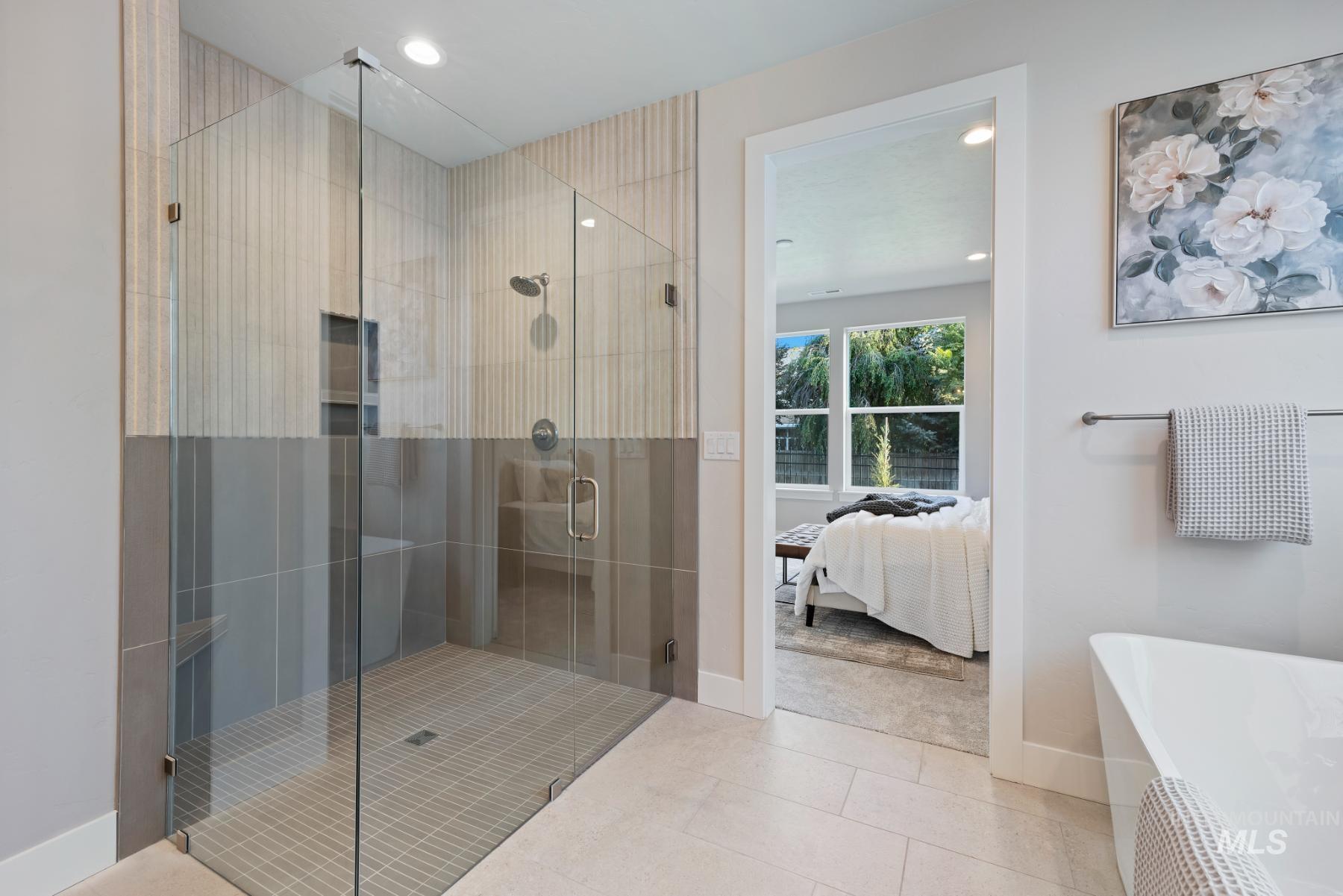 Full bath with ensuite bath, a shower stall, tile patterned floors, recessed lighting, and a freestanding bath