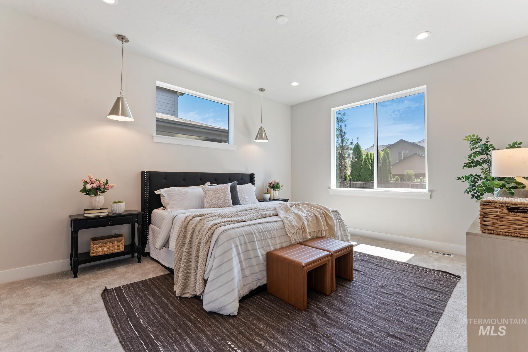 Carpeted bedroom with baseboards and recessed lighting