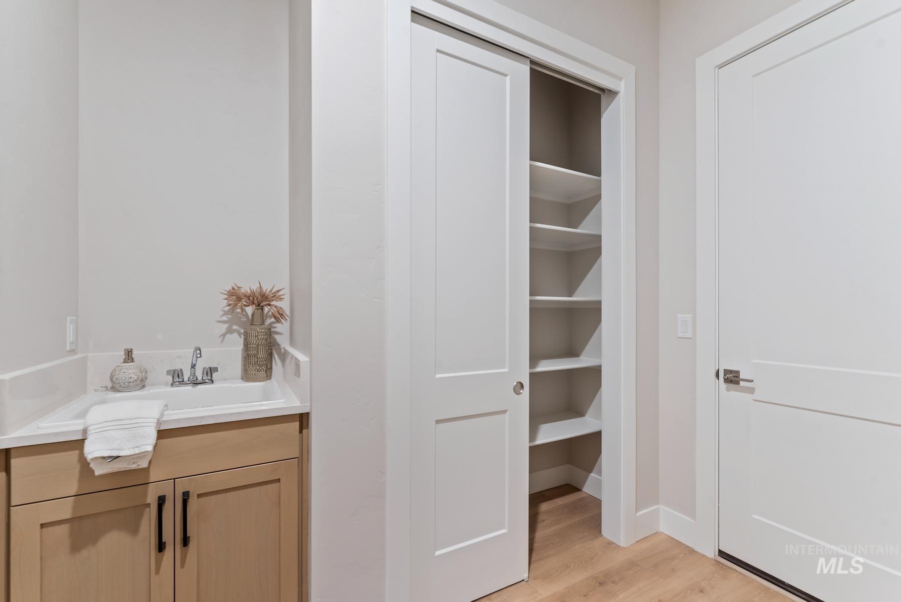 Bathroom with vanity and light wood-style floors