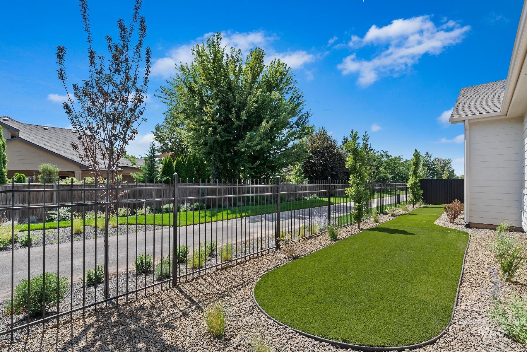 View of fenced backyard