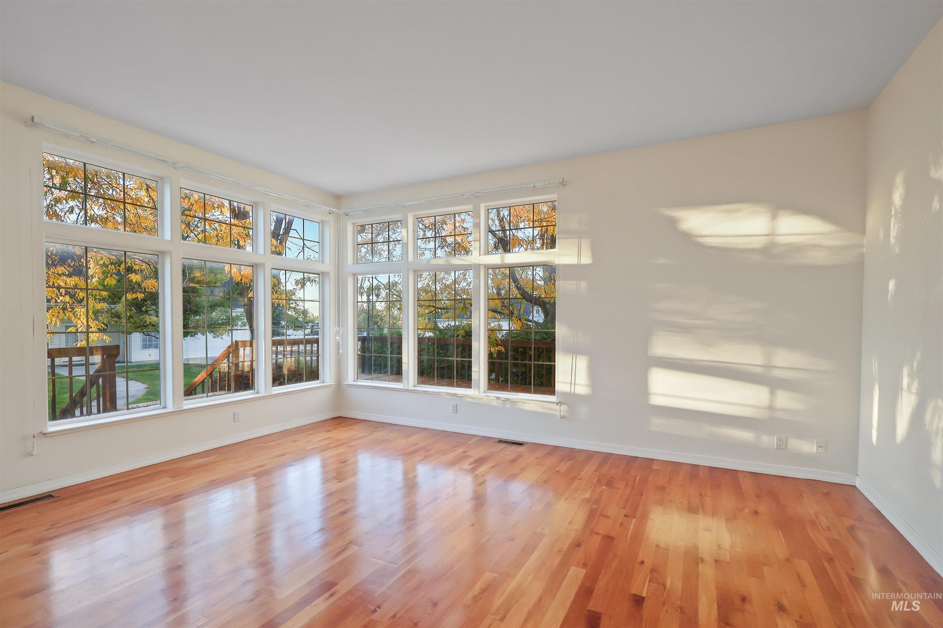 Empty room featuring light wood-type flooring and baseboards