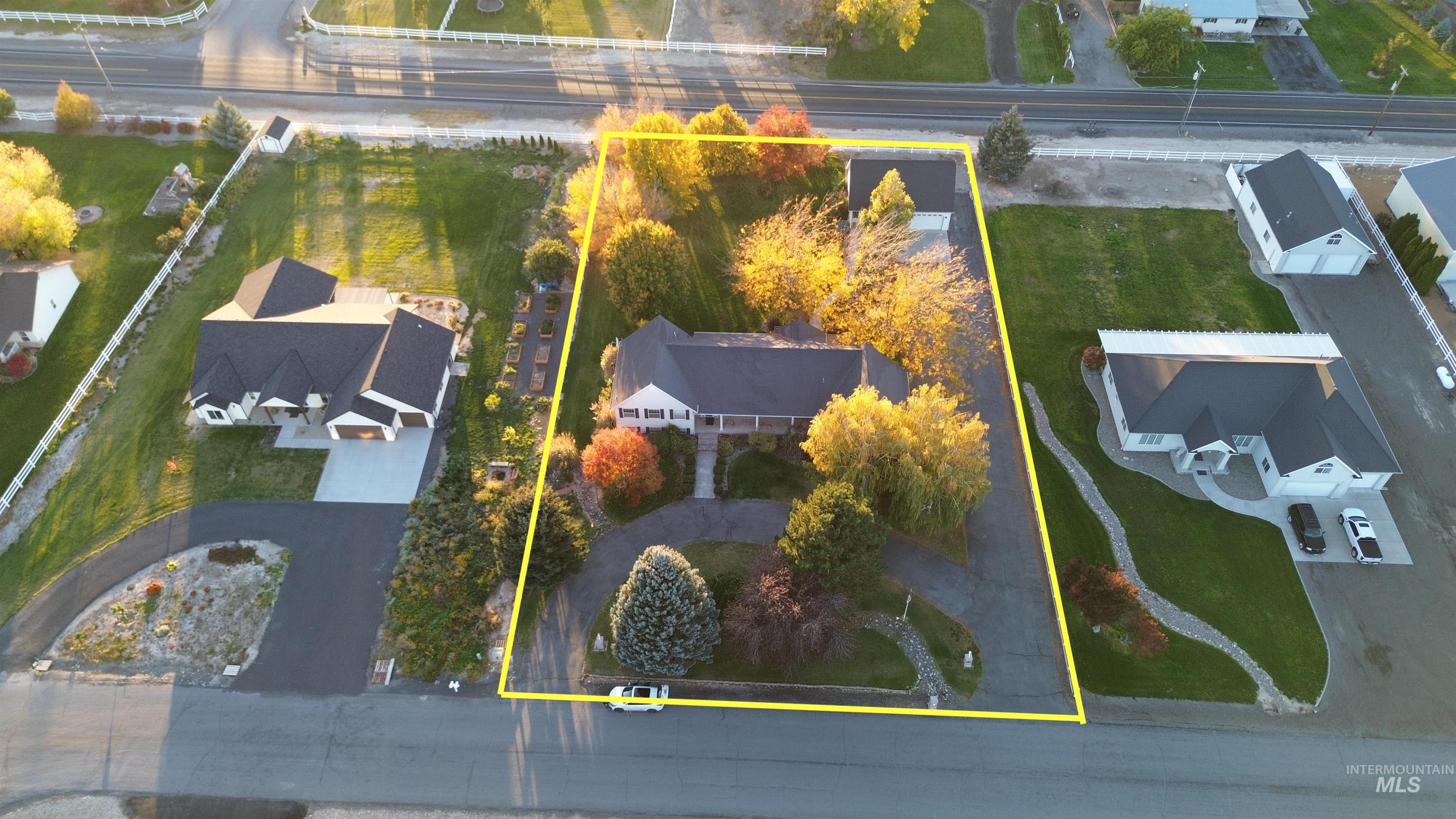Aerial perspective of suburban area featuring property boundaries highlighted