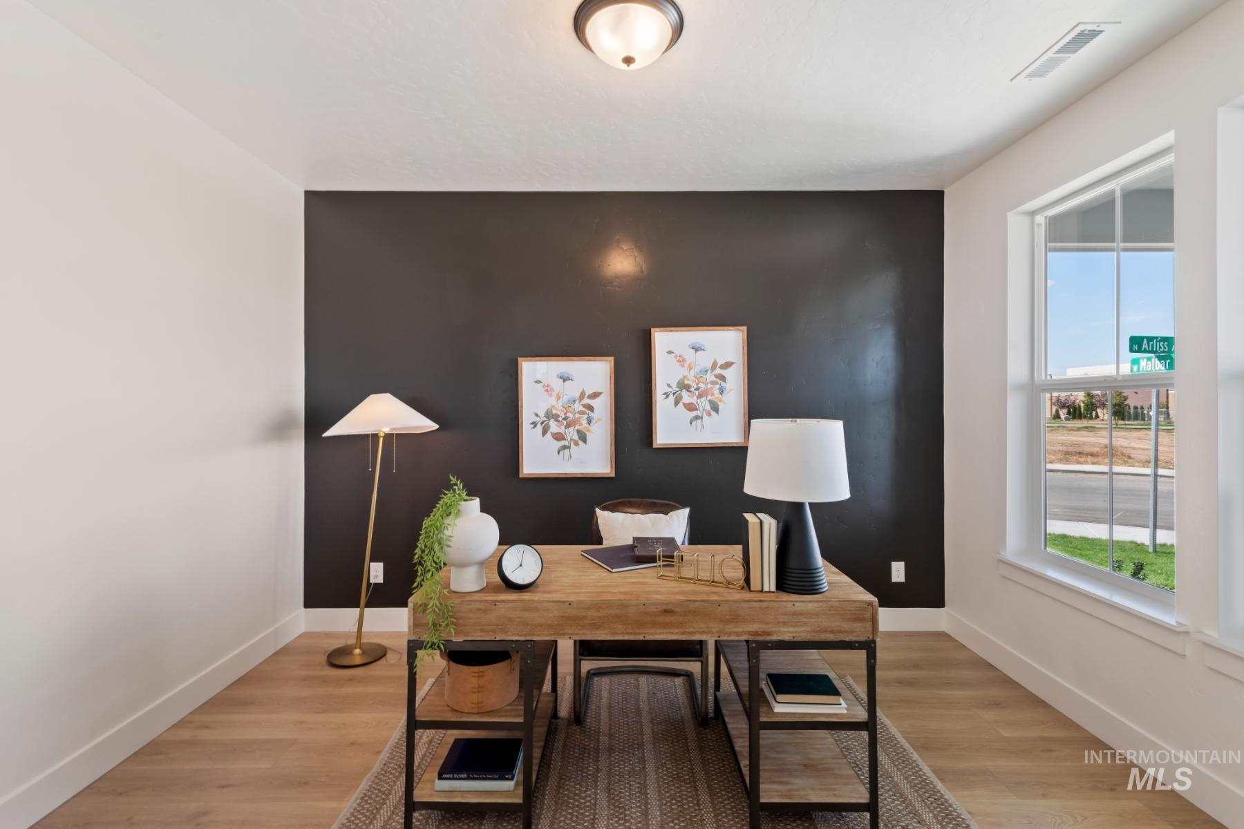 Office with light wood-style flooring