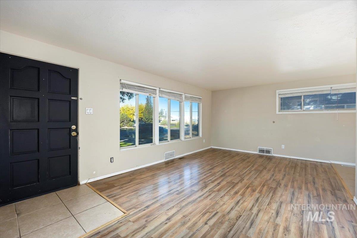 Entrance foyer with wood finished floors