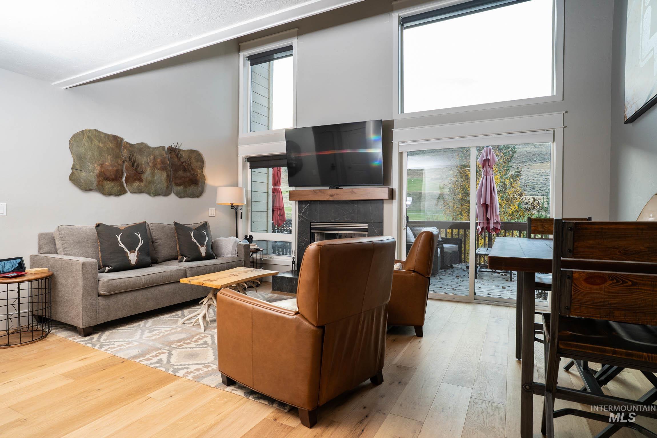 Hardwood flooring, gas fireplace, custom lights and fans