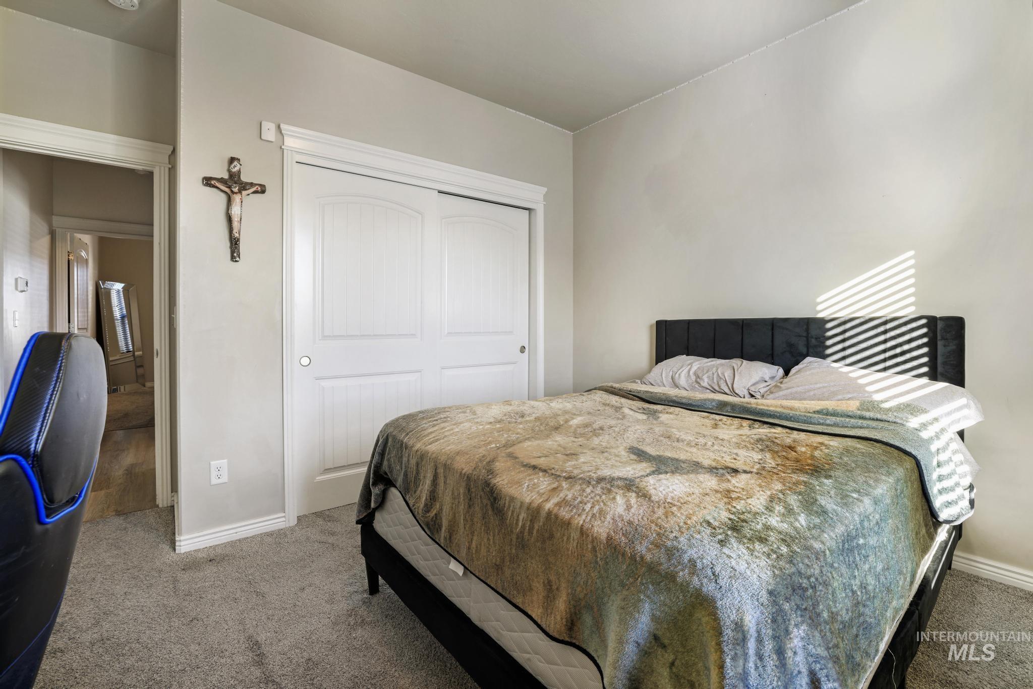 Bedroom with a closet and carpet flooring