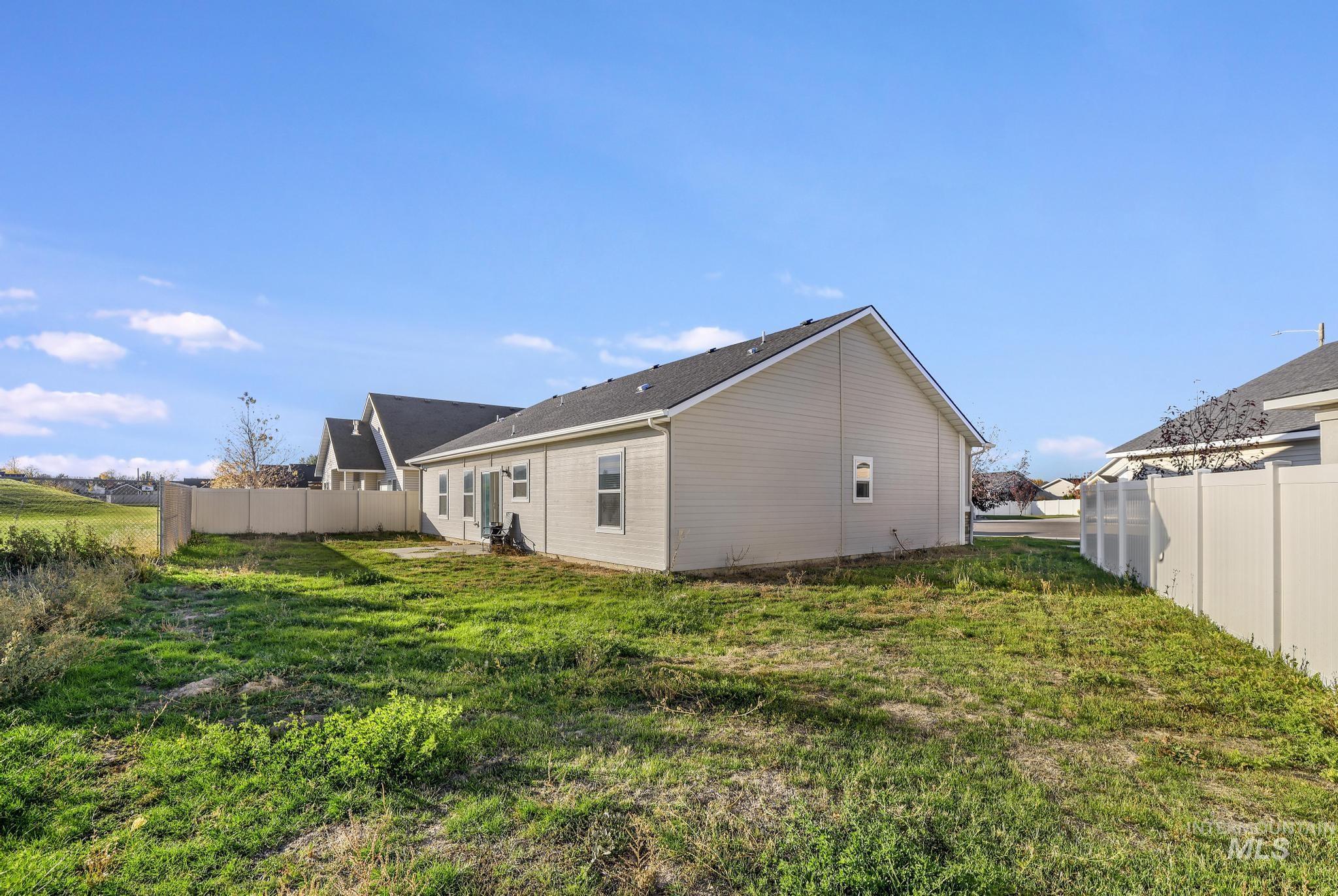 View of side of property with a fenced backyard