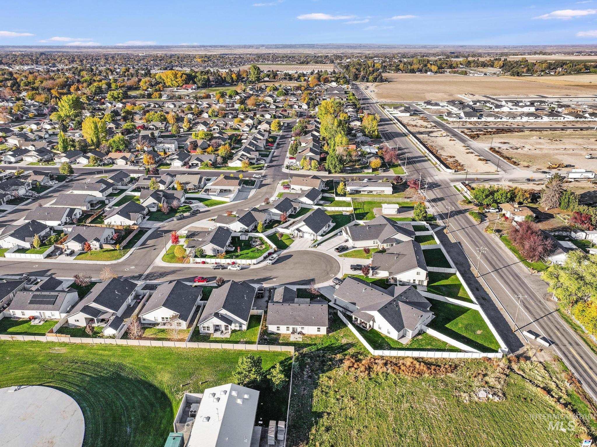 Aerial overview of property's location with nearby suburban area