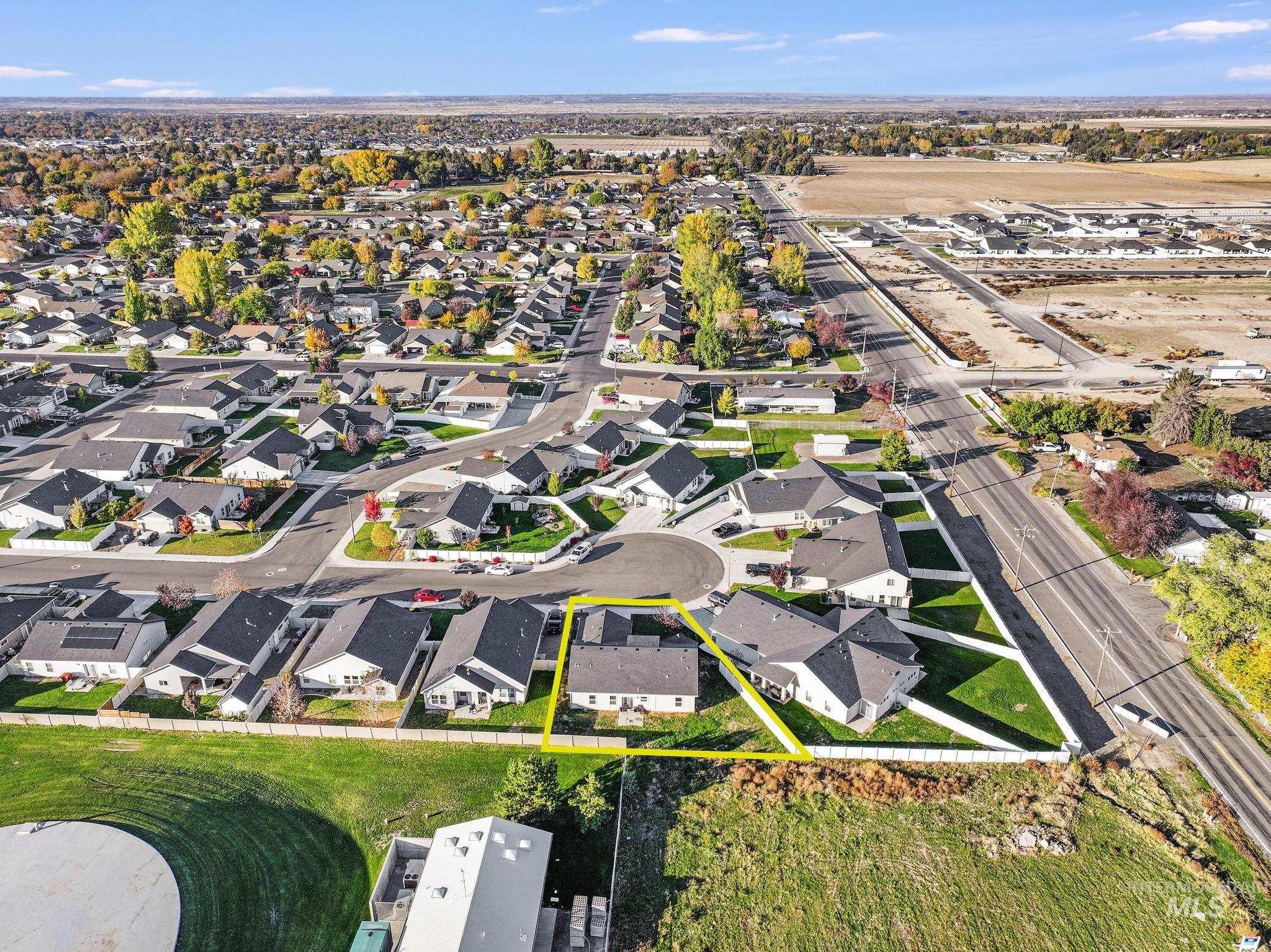 Aerial overview of property's location with nearby suburban area