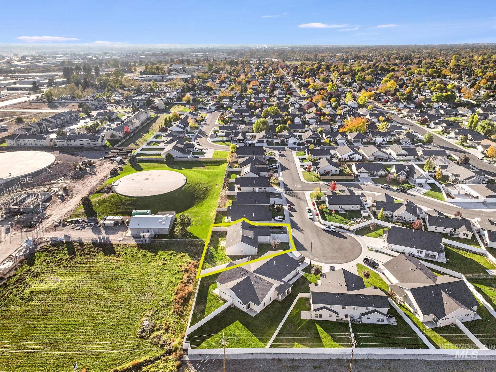 Aerial view of residential area with property parcel outlined
