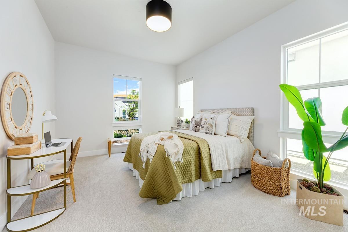 Bedroom with carpet flooring and baseboards