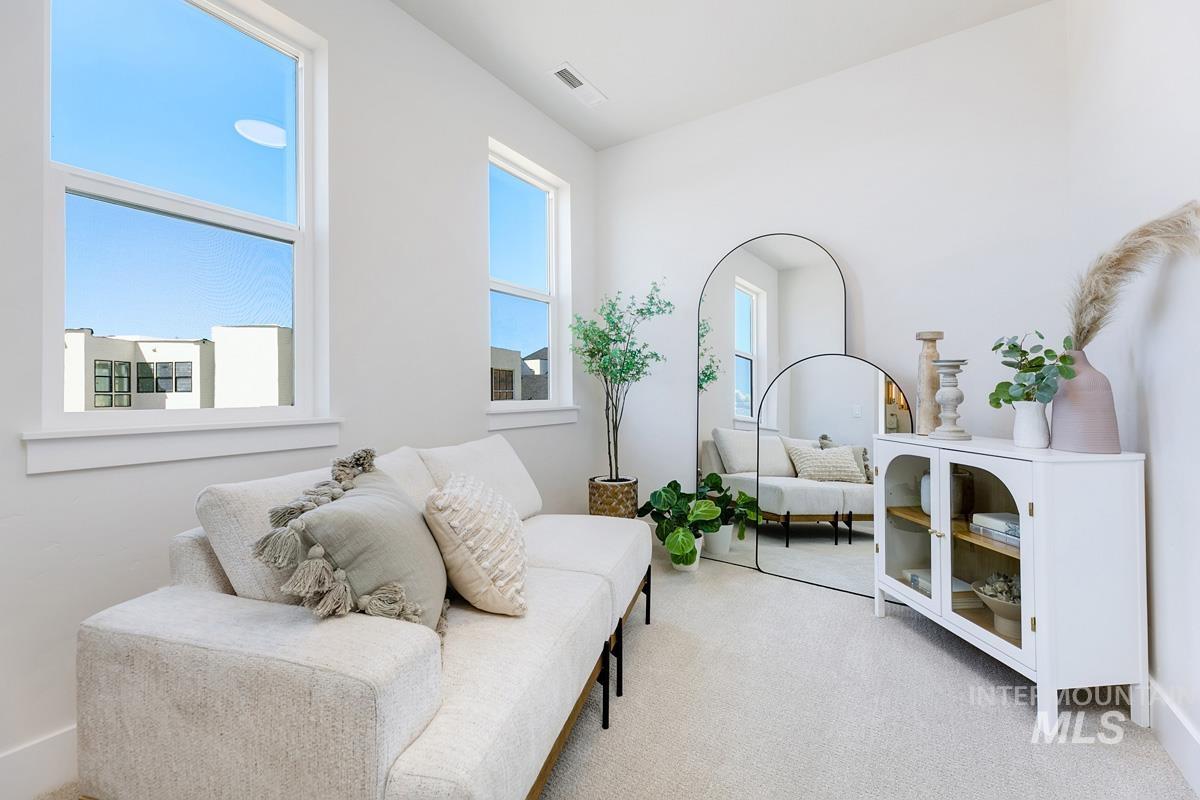 Sitting room with light carpet