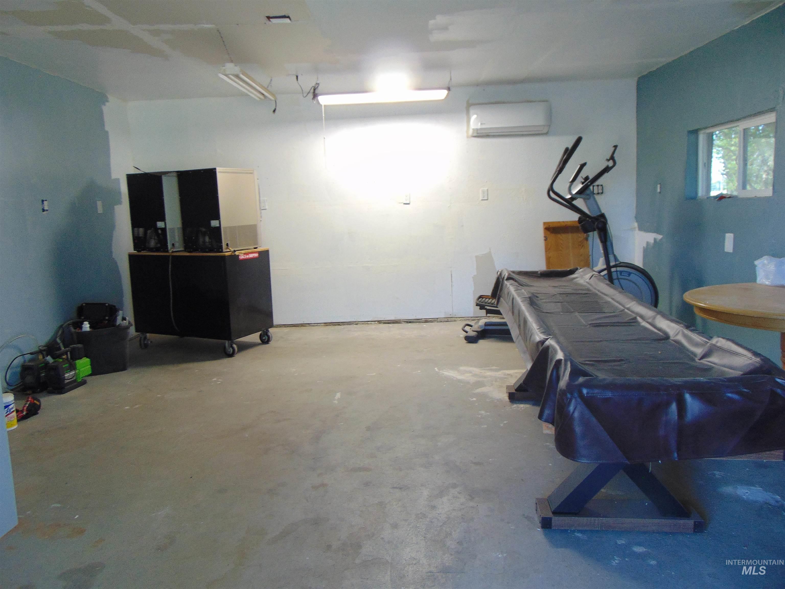 Garage featuring a wall mounted AC