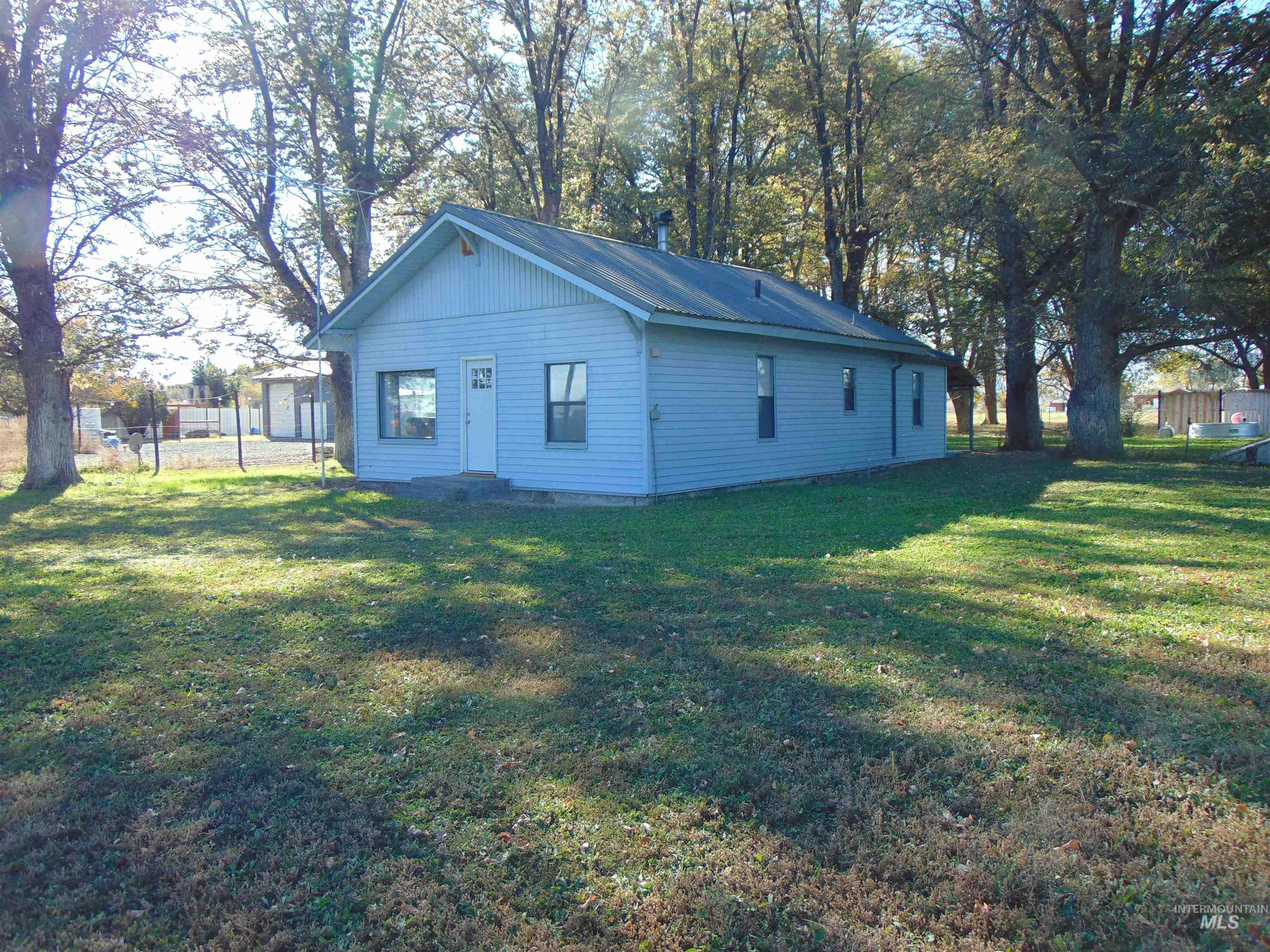 Back of house featuring a metal roof