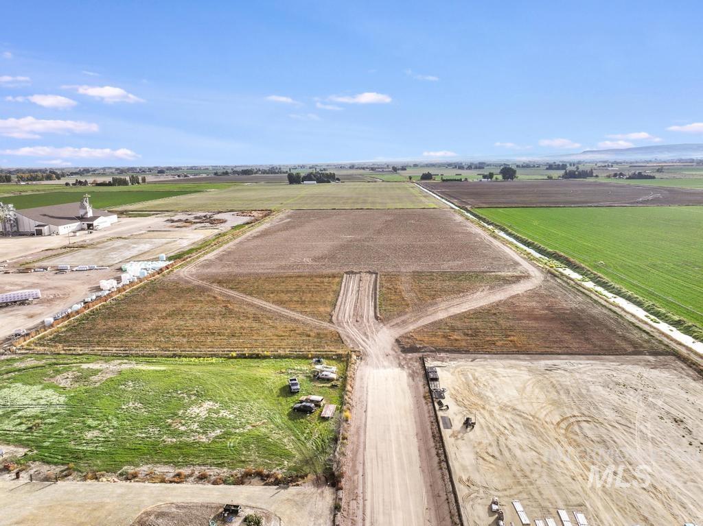 Aerial view of property and surrounding area with rural landscape and abundant farmland