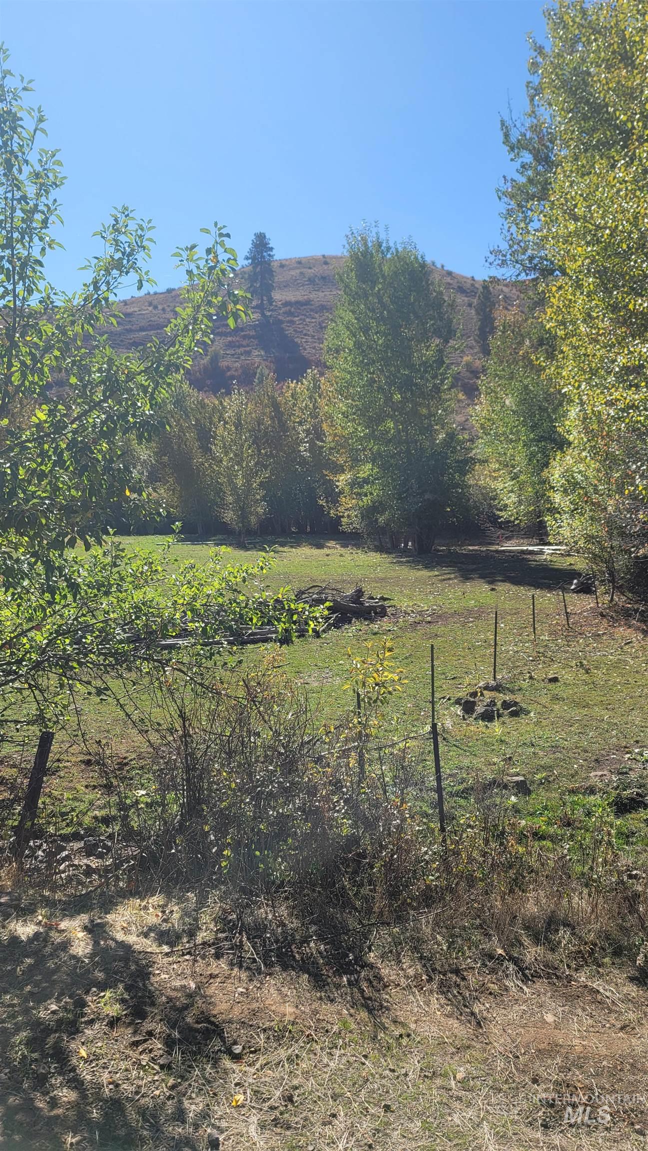 View of yard featuring a view of rural / pastoral area and a mountain view