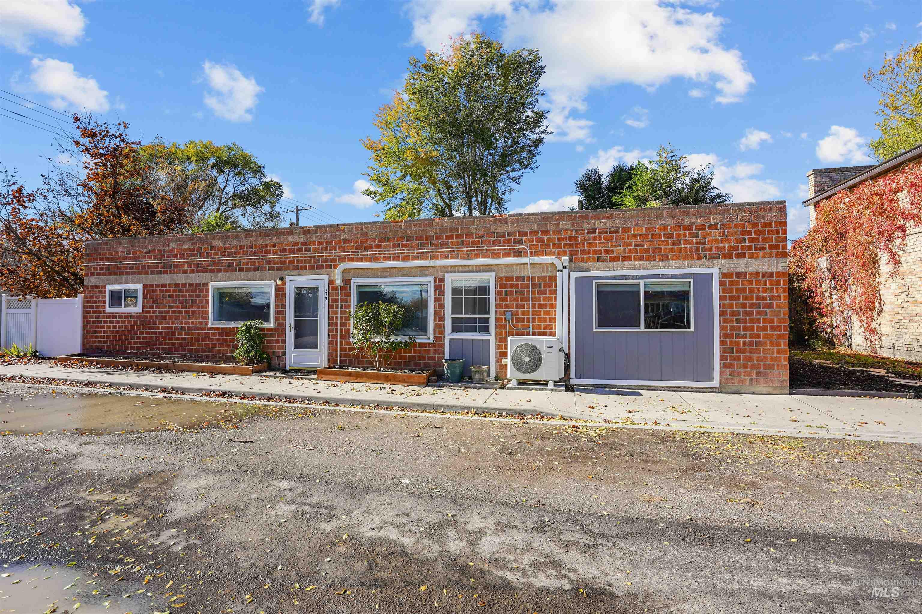 View of front of house with brick siding