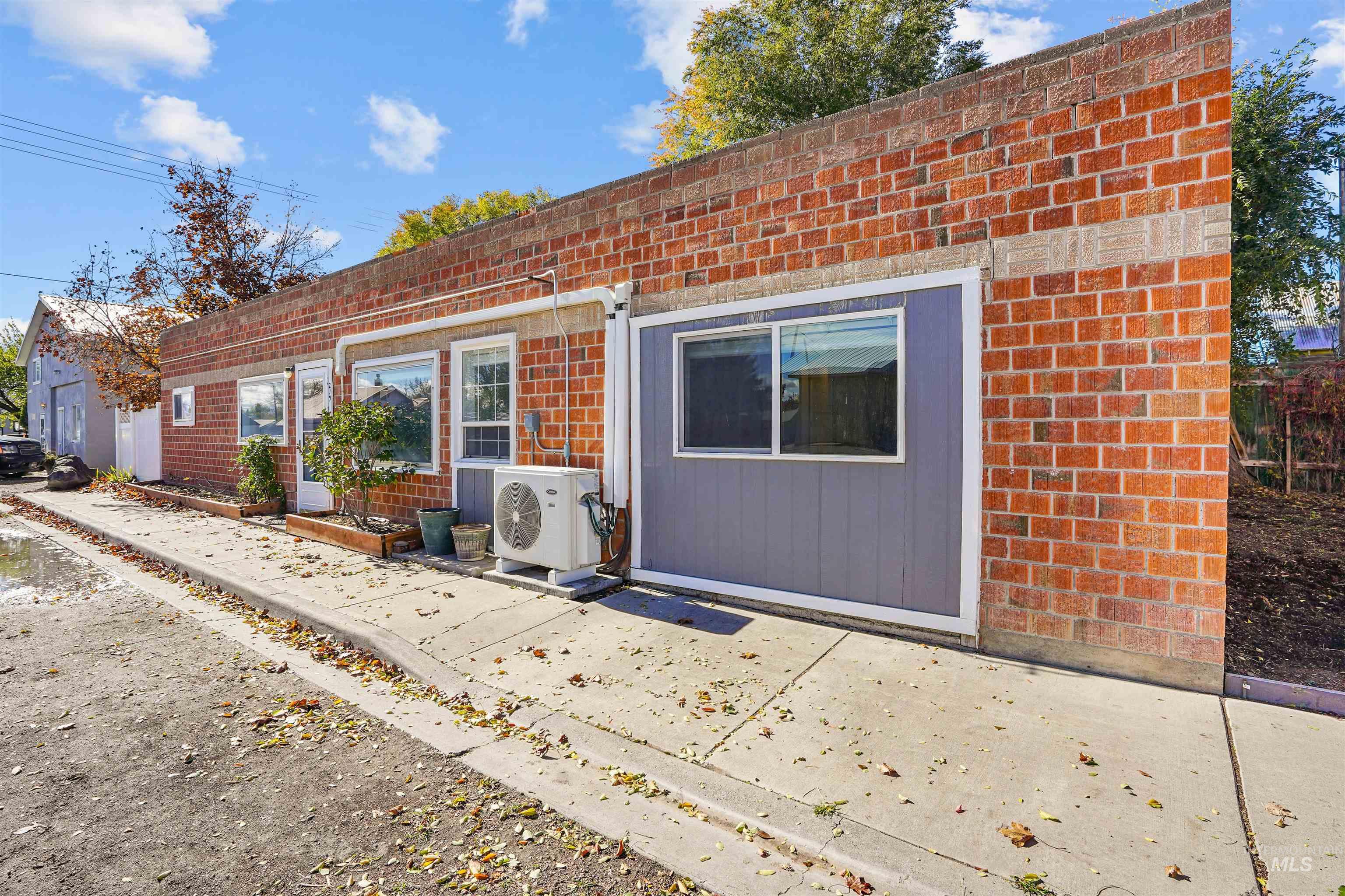 Back of house with brick siding