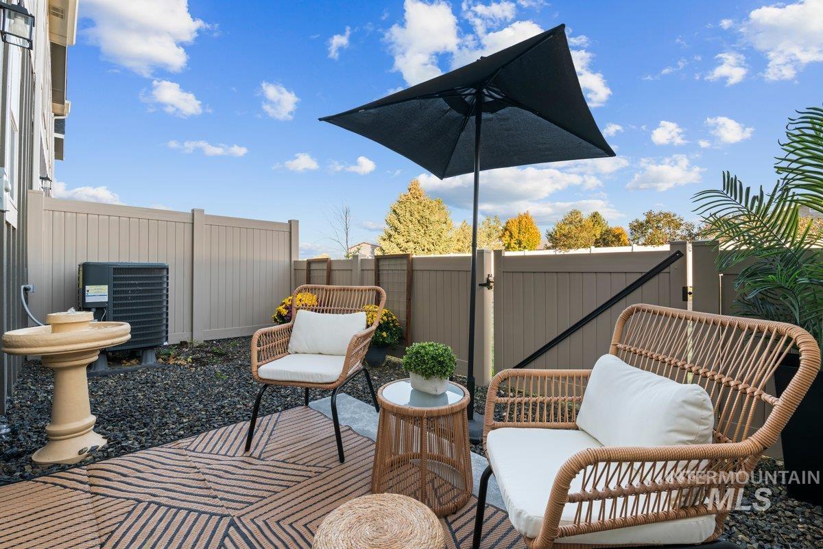 View of patio featuring a gate