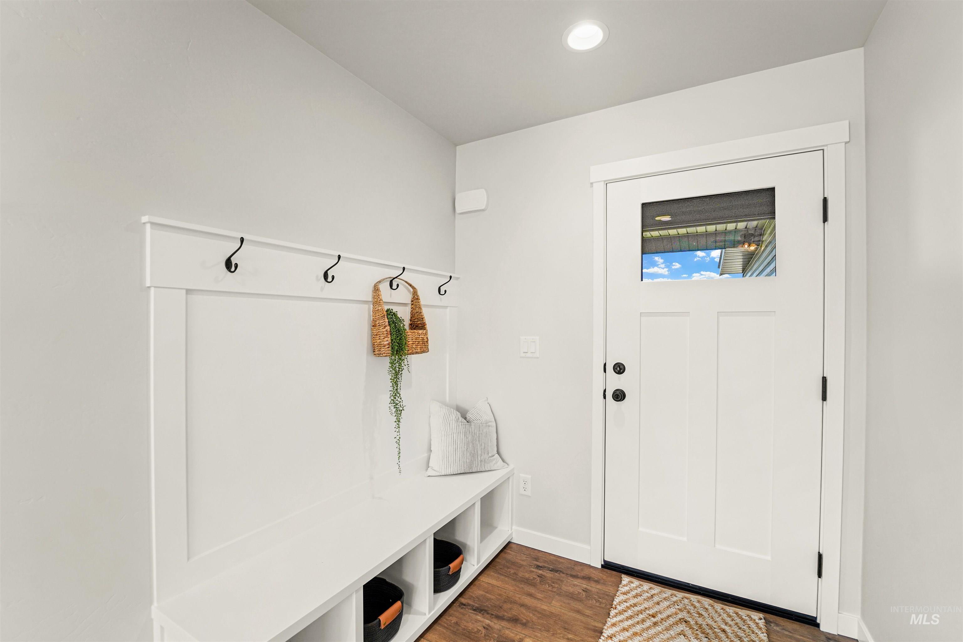 Mudroom featuring dark wood-style floors and recessed lighting