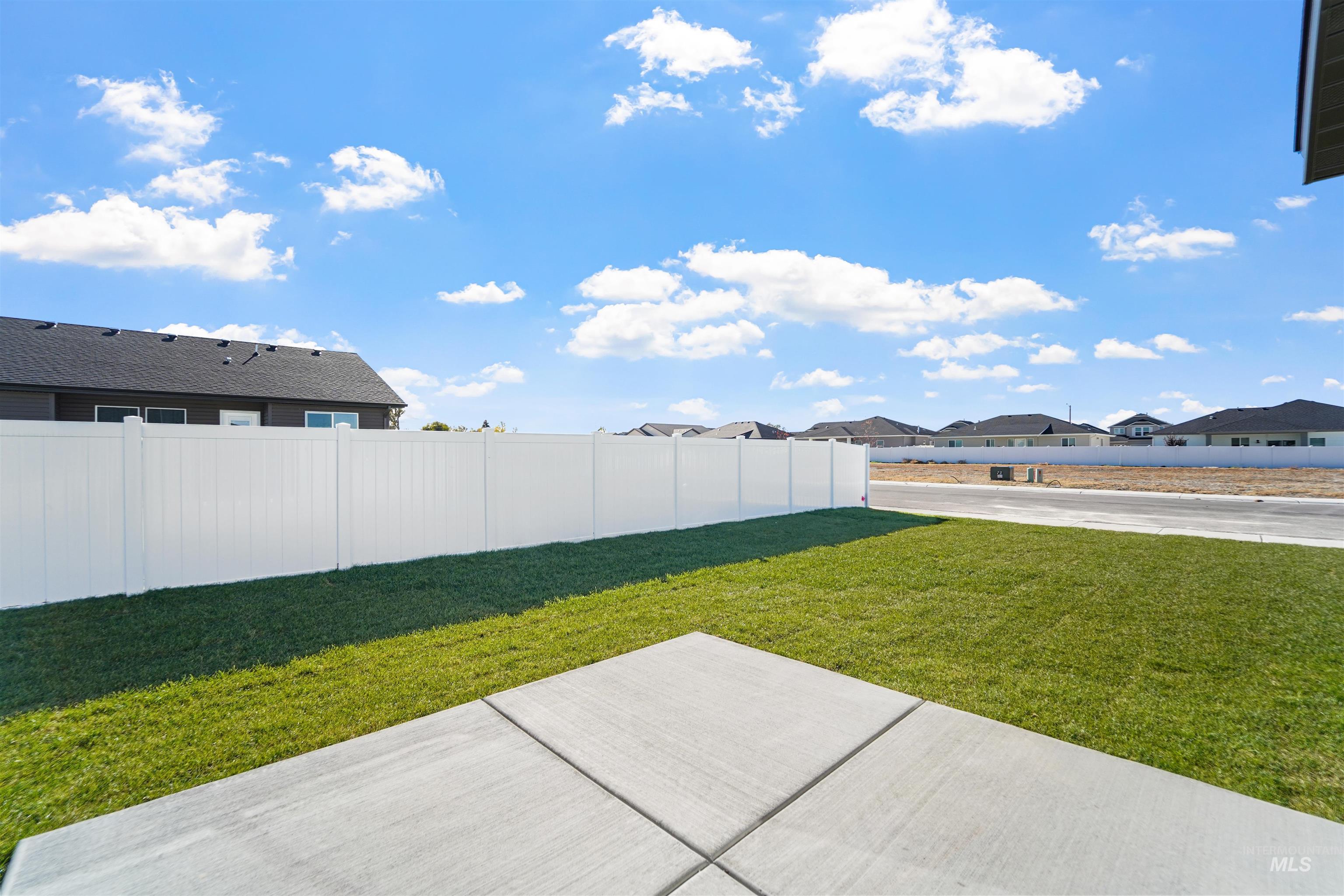 View of yard featuring a residential view and a patio