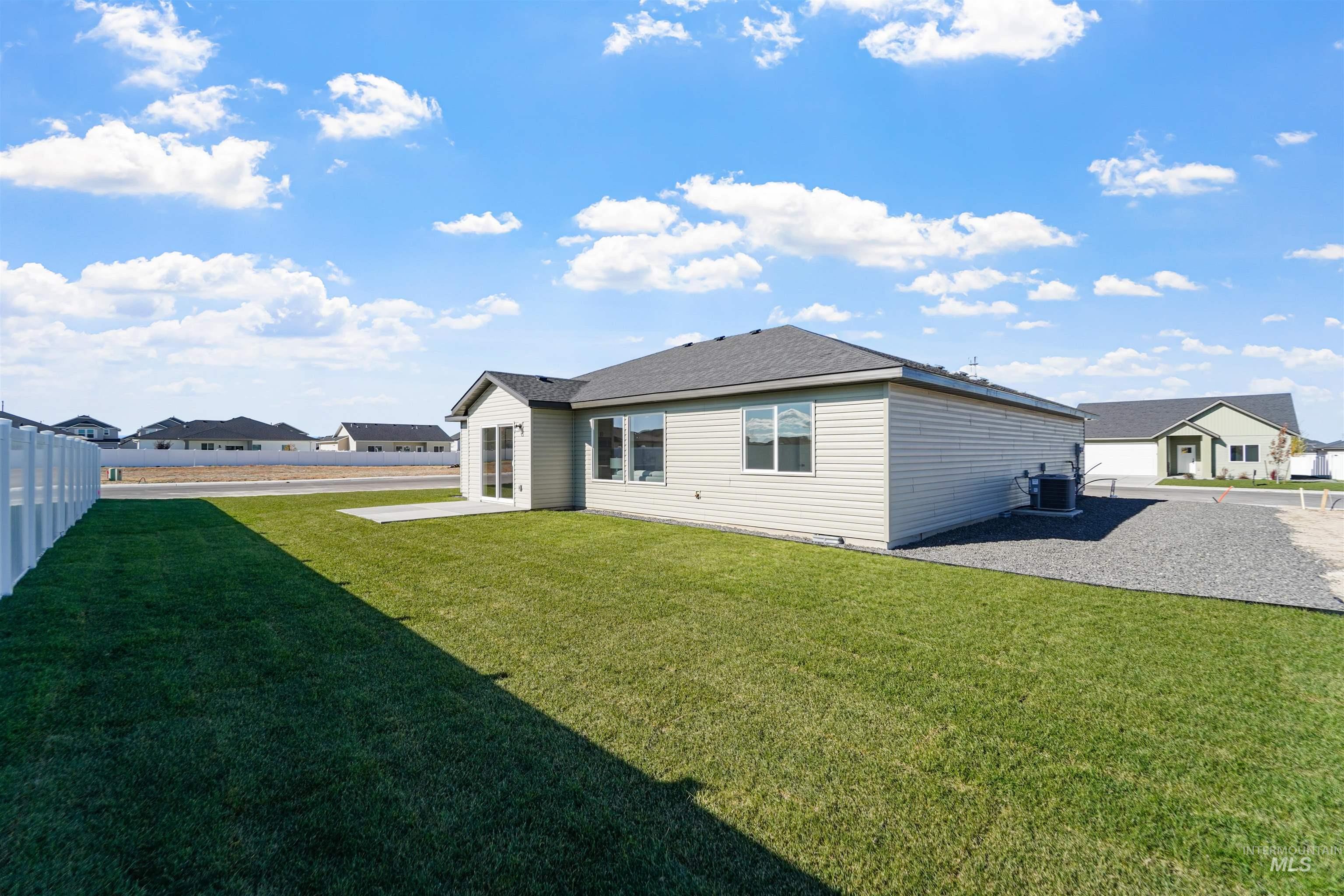 Rear view of property featuring a patio area