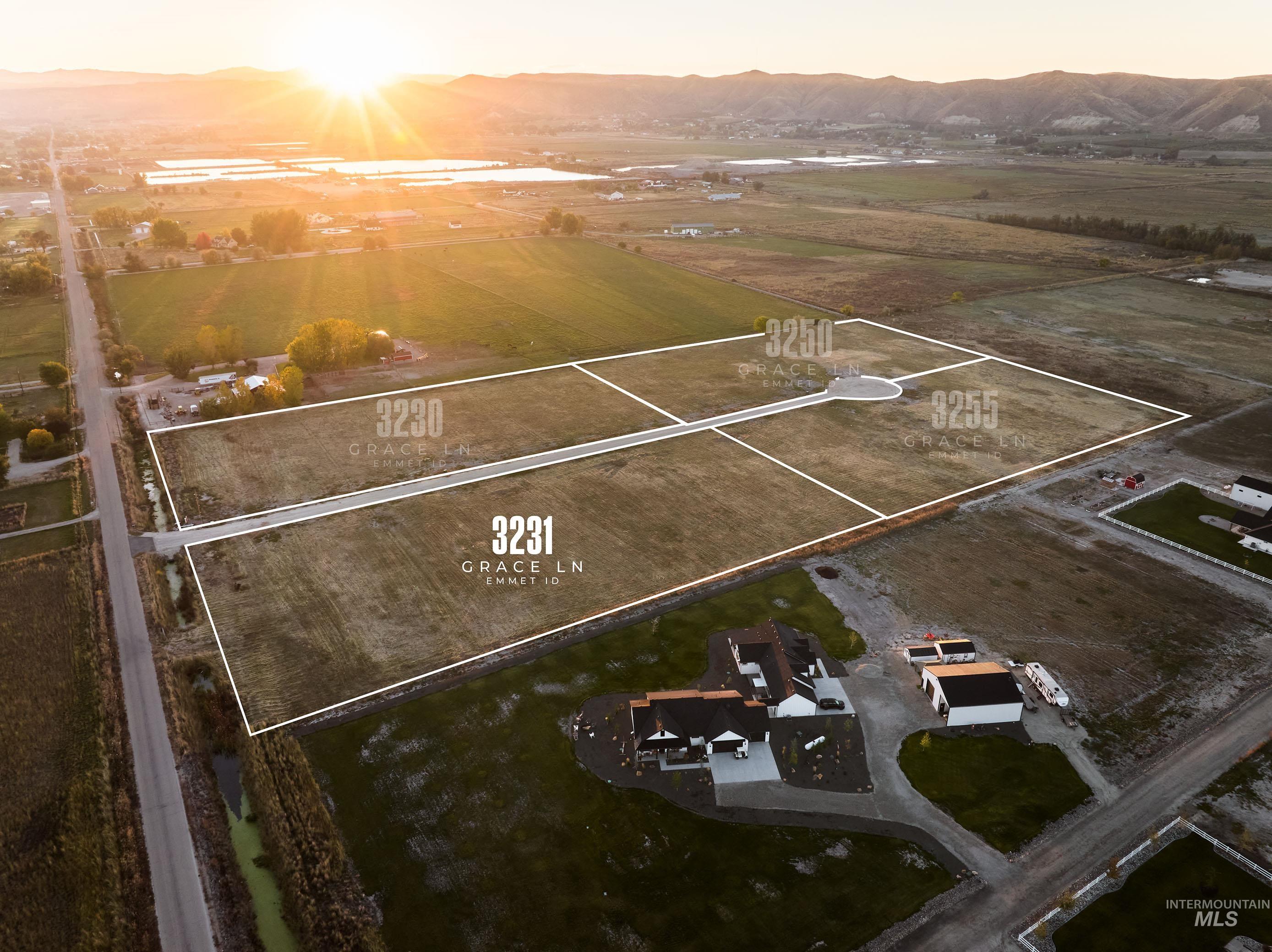 Aerial view at dusk of a mountain view, a view of countryside, and property boundaries highlighted