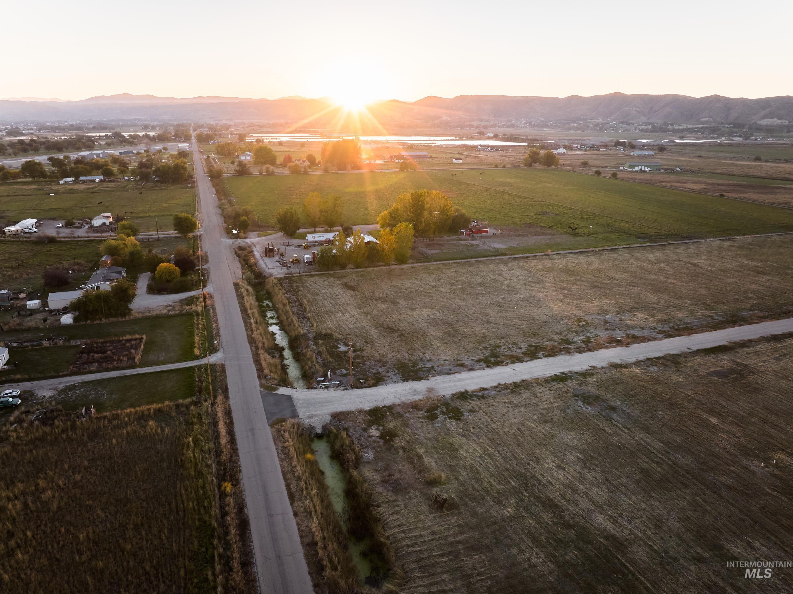 Aerial overview of property's location featuring rural landscape and mountains