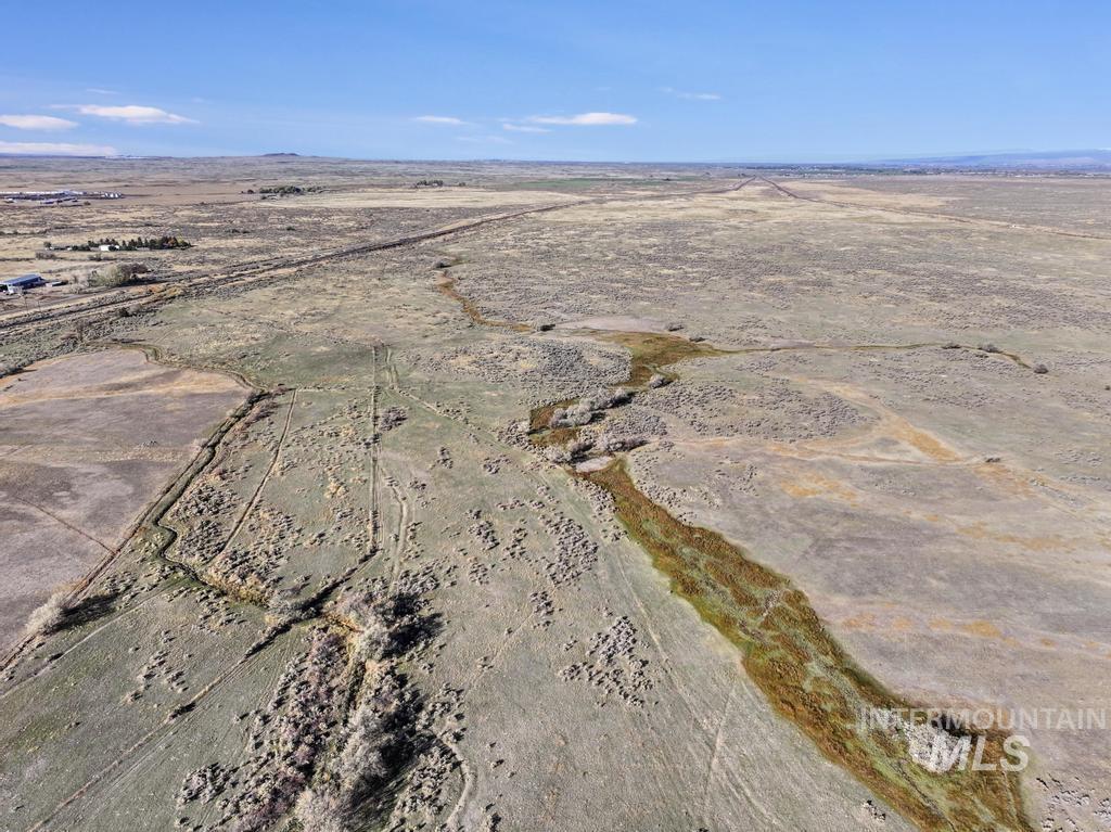 Aerial view of property's location with rural landscape and a desert landscape