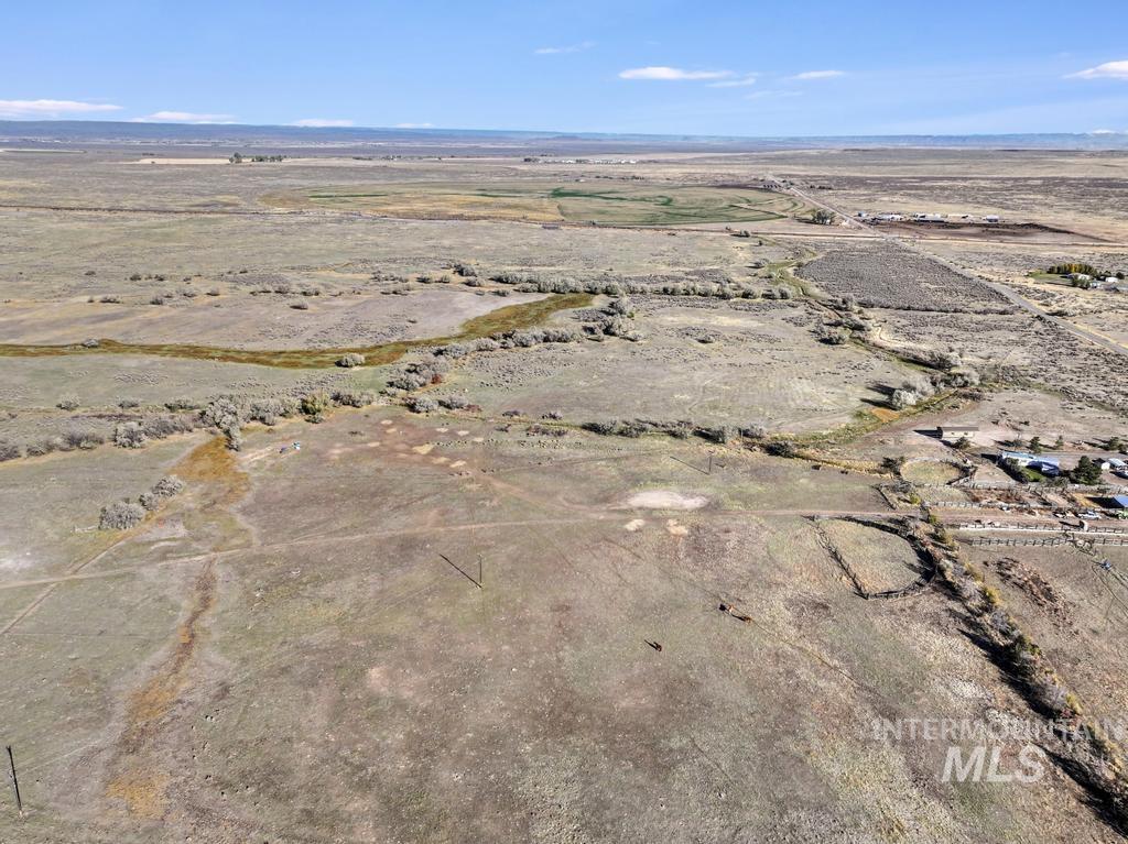 Aerial overview of property's location featuring rural landscape and a desert landscape