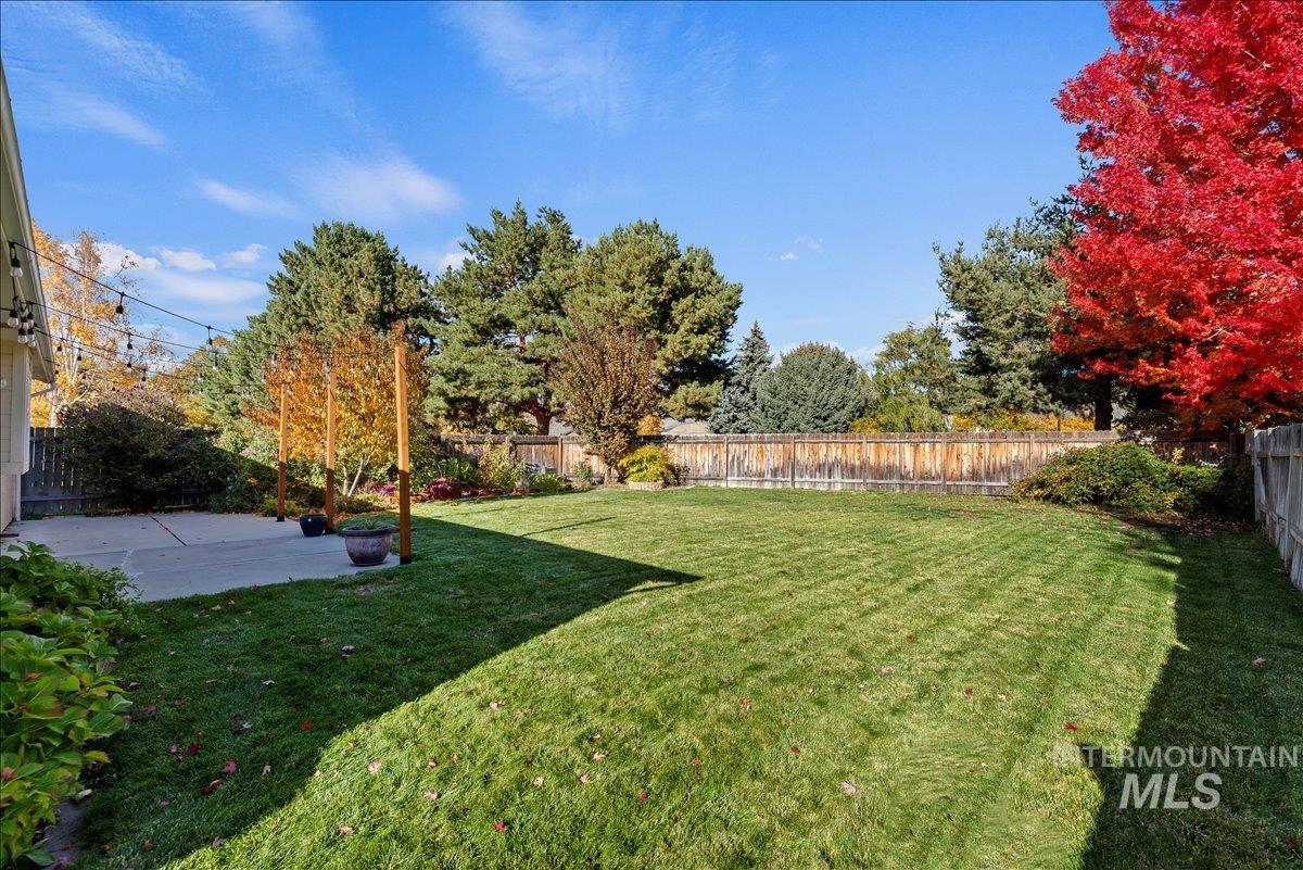 Fenced backyard featuring a patio area